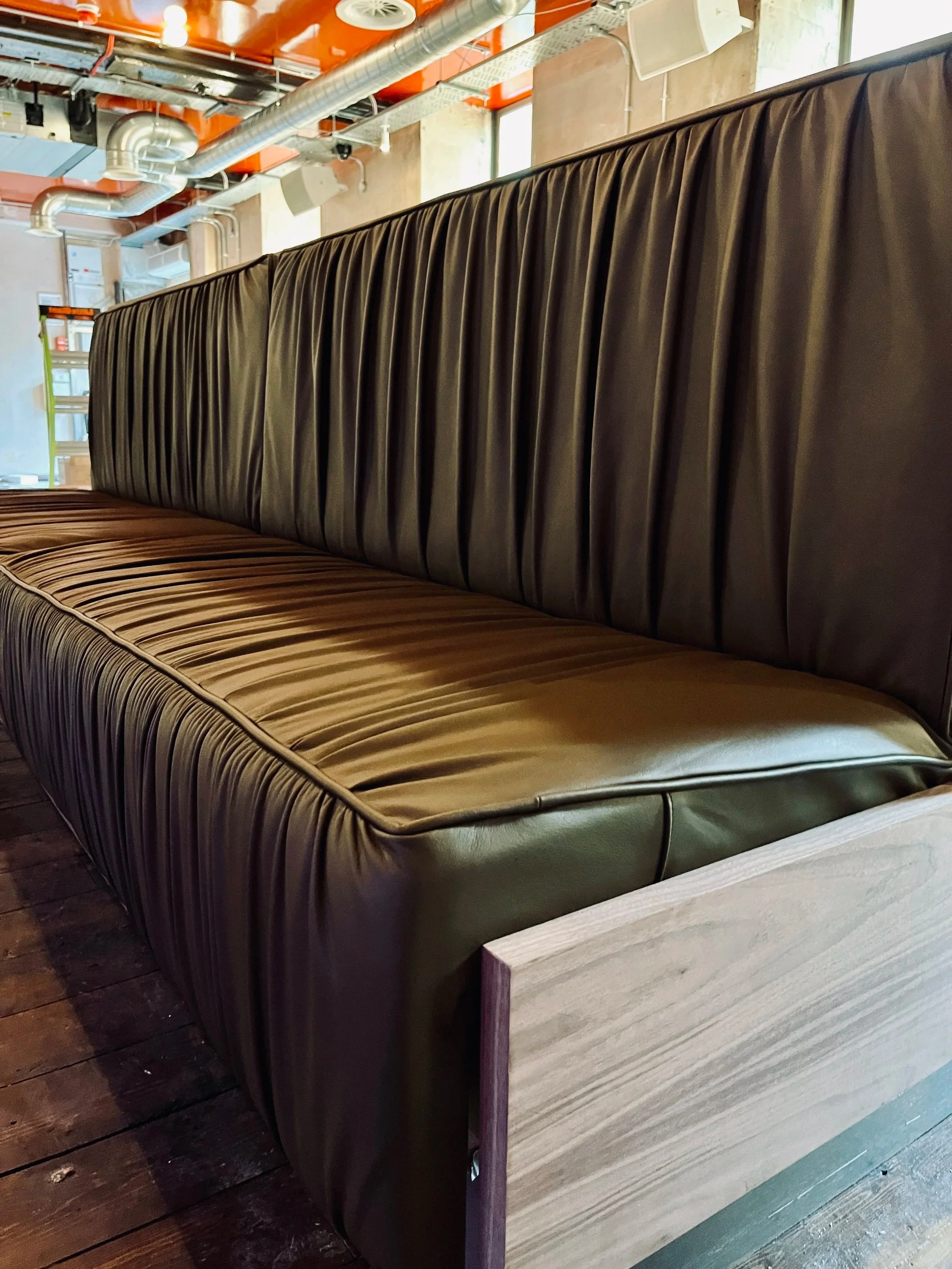 The challenge with this project was designing the piece so it was transportable. We worked with our CNC partner to have it constructed so it could be assembled on site but appear as one solid piece.