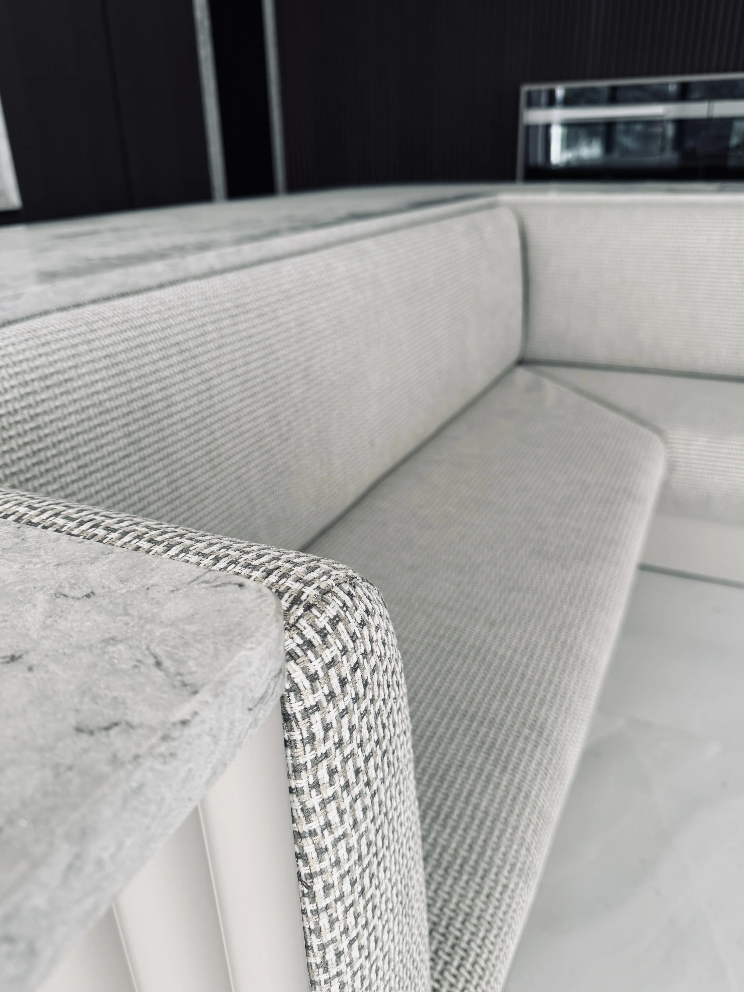 Upholstered in Romo's Kiku in taupe - a chenille with a small-scale, basket weave design. Durable whilst complementing the neutral palette of the interior. 
