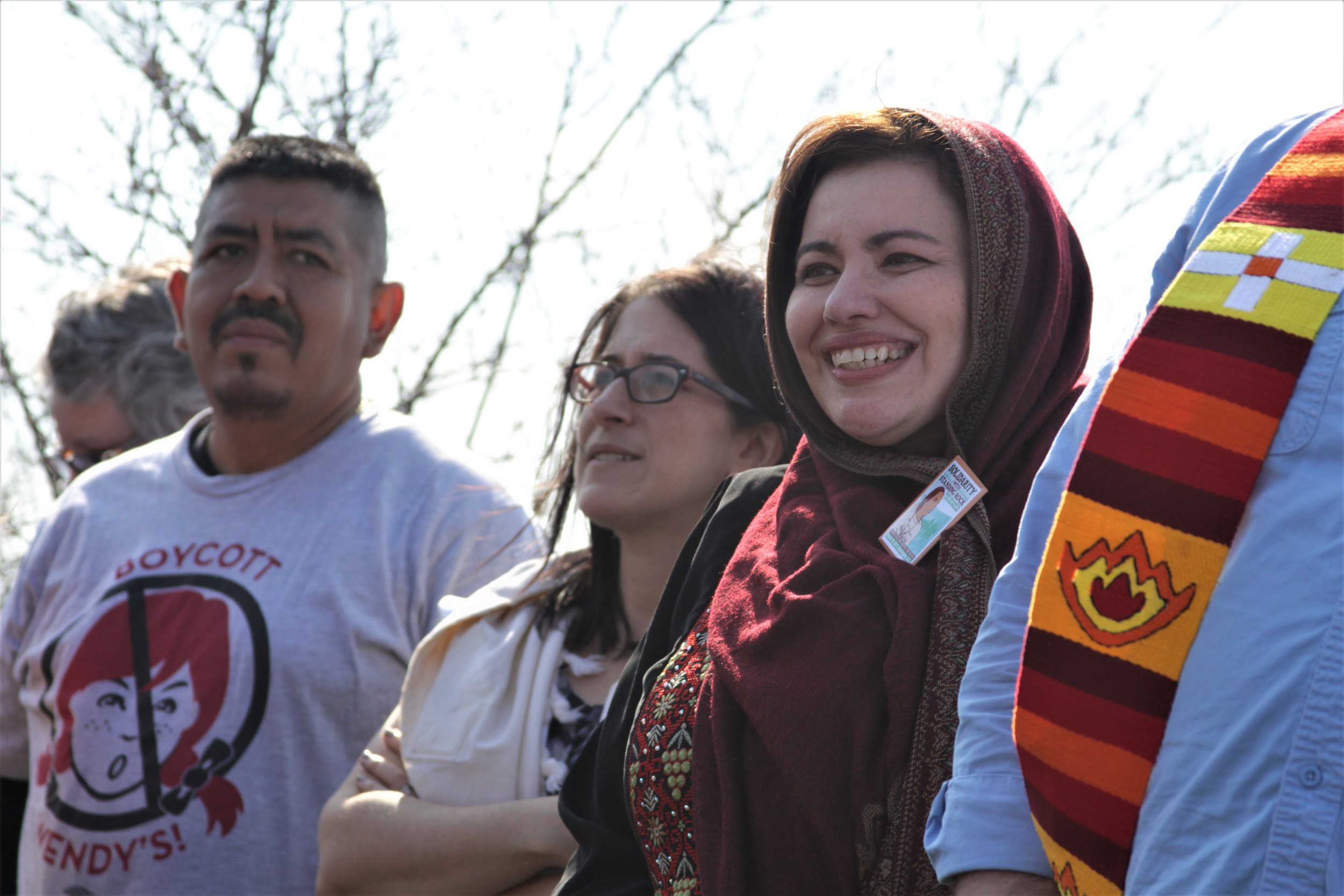  CIW's Lucas Benitez joins Rachel Kahn-Troster, Director of Programs for T'ruah and Sahar Alsahlani, Board Member of the Council on American Islamic Relations (CAIR) to welcome the nearly 100 gathered for a vigil outside Wendy's headquarters in Dubli