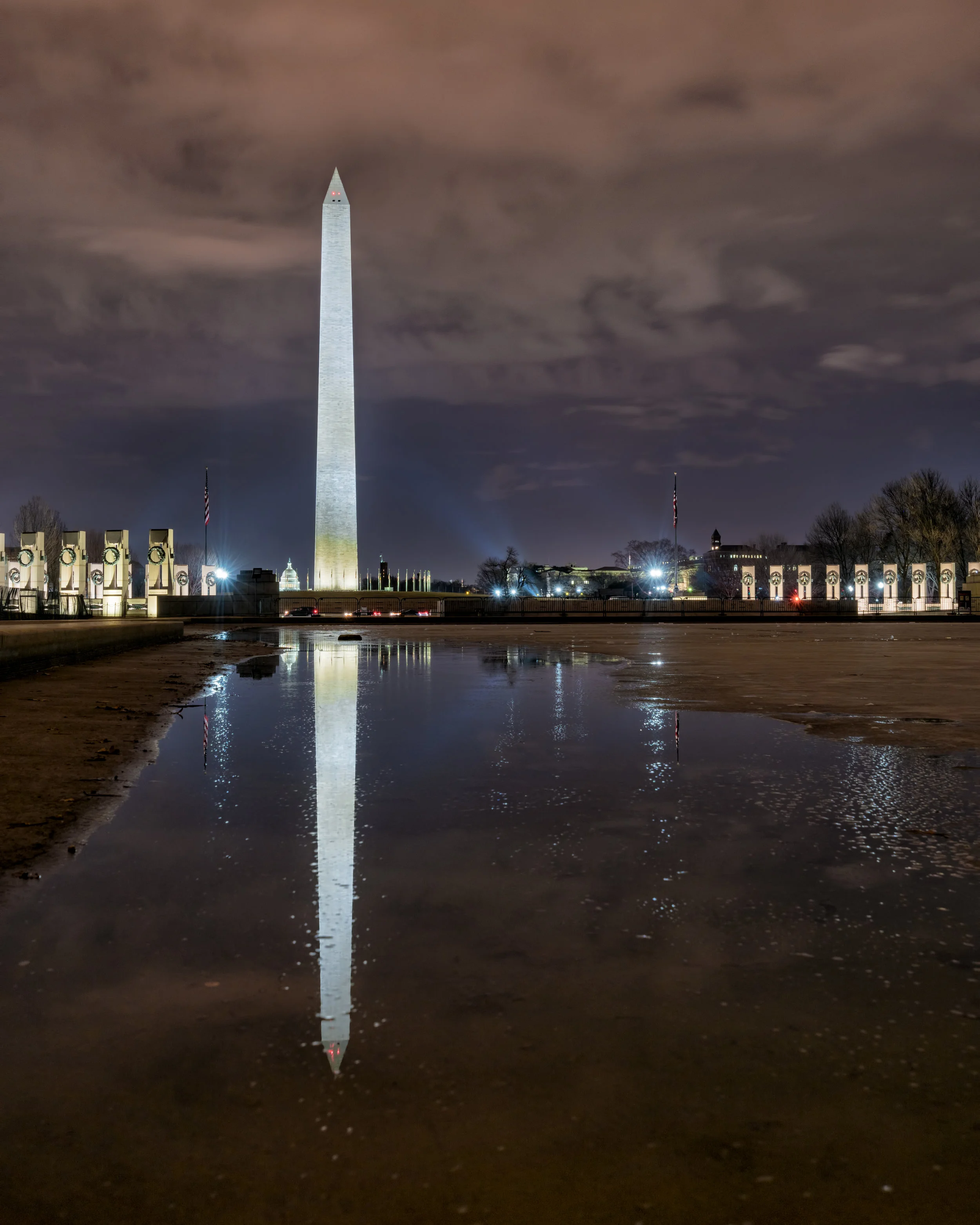 This was a bit of a unique angle as I was able to step out into the reflecting pool as the water is starting to thaw and some fun textured water for reflections of the flags, State Capitol, World War II Memorial and Washington Monument.