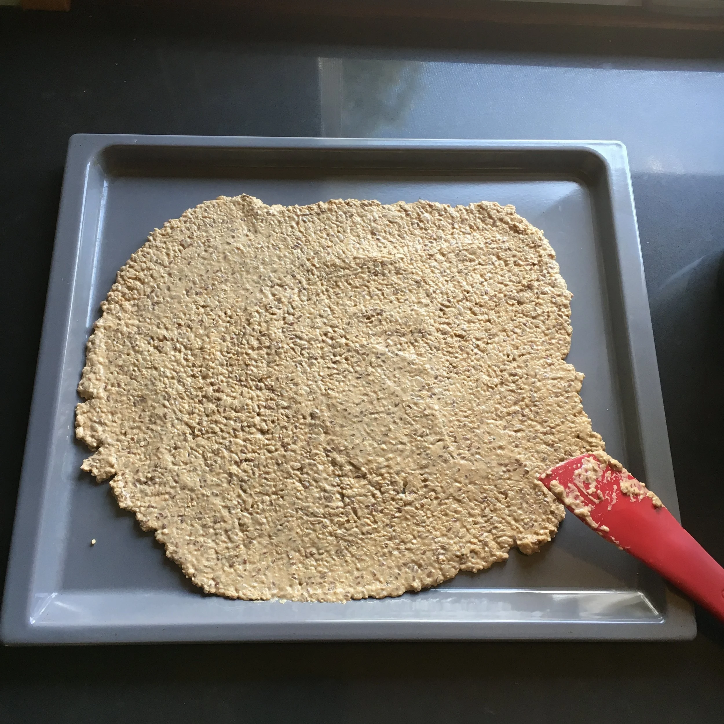 Place mixture on baking tray, spread out