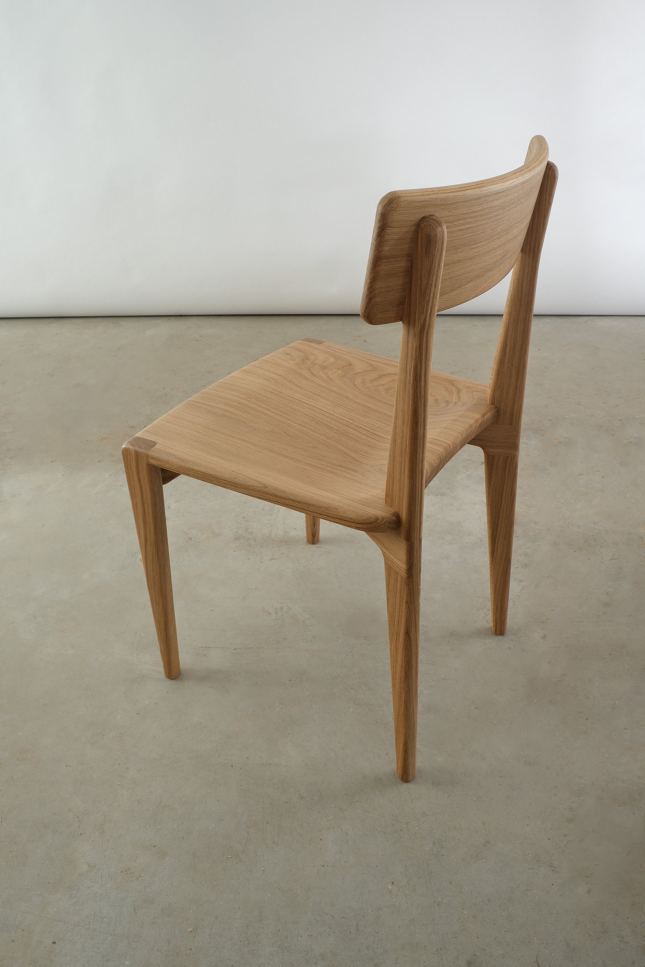 durham chair in oak with white background 3:4 back view higher angle.JPG
