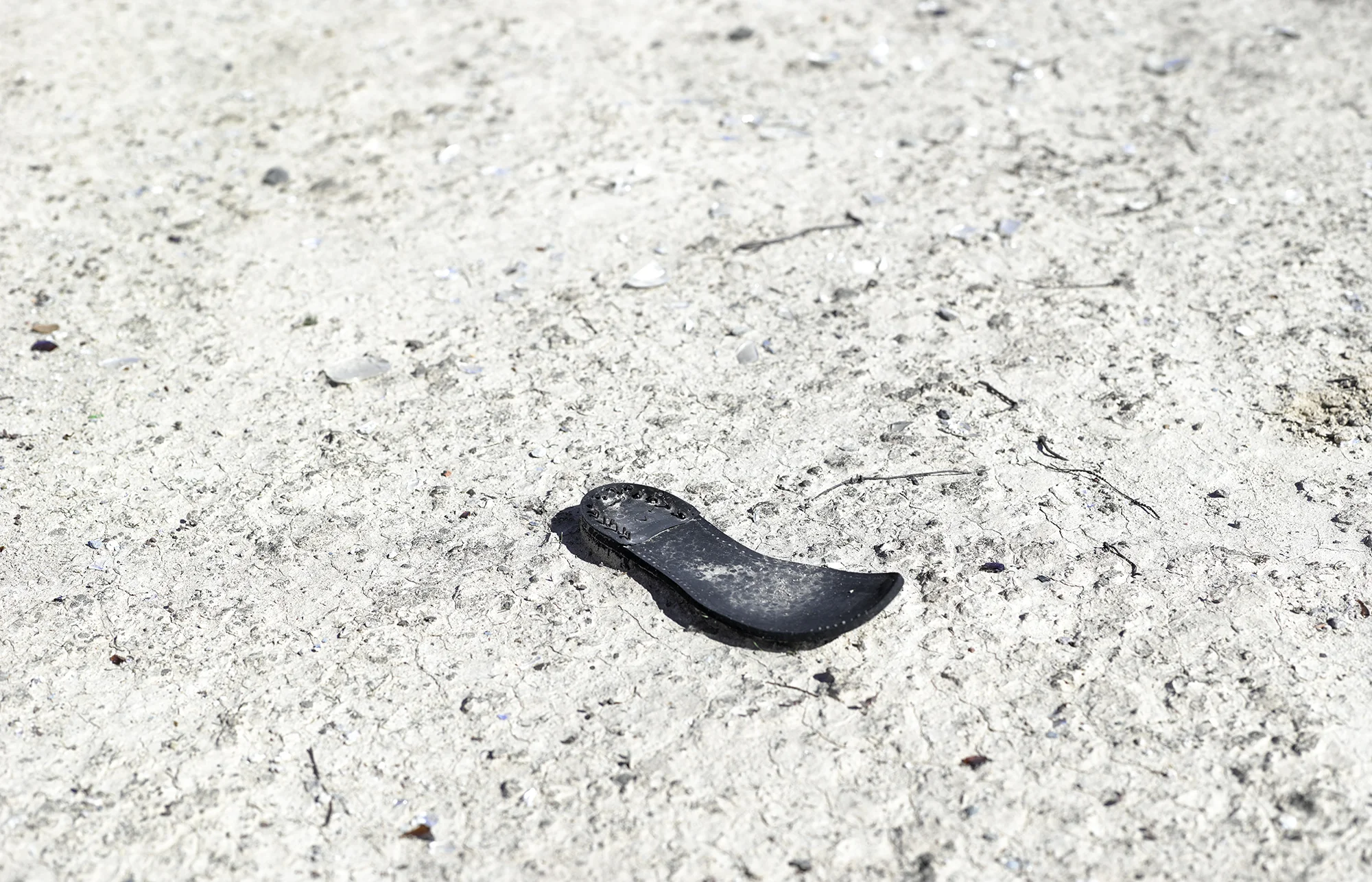 Shoe sole on hard desert ground, 2013