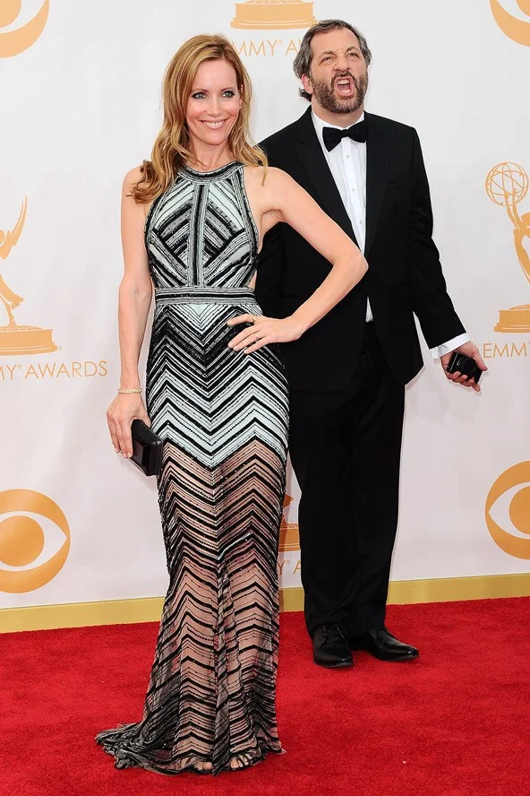 Leslie Mann and her husband Judd Apatow pose for pictures on the red carpet in 2013. 