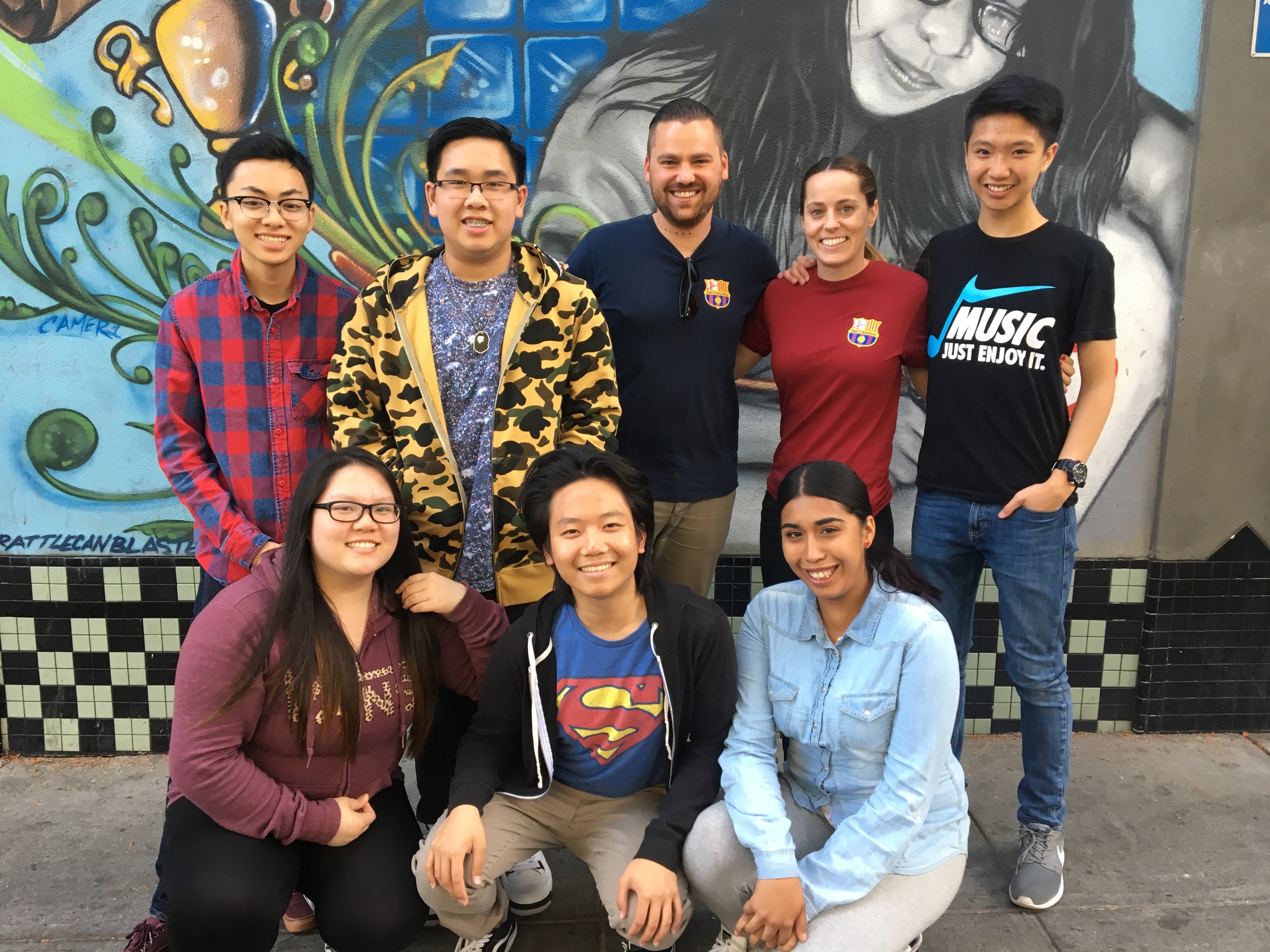 Matthew Manson of Penya Barcelonista San Francisco, Ashley Monro of Boys & Girls Clubs of San Francisco and local youth.