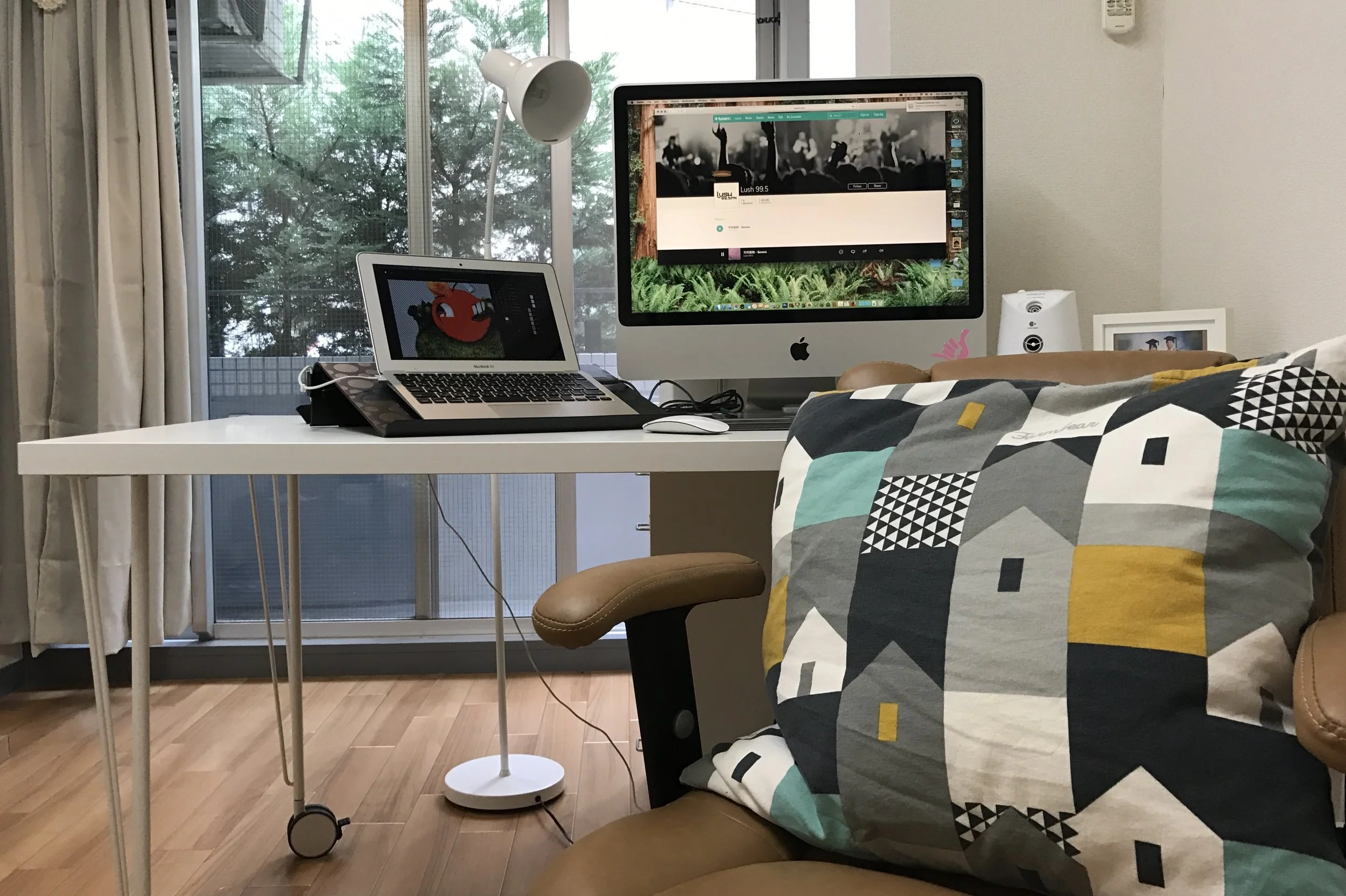 The desk put together with KRILLE legs and LINNMON 200cm table top with a laptop stand with BRADA laptop support . 