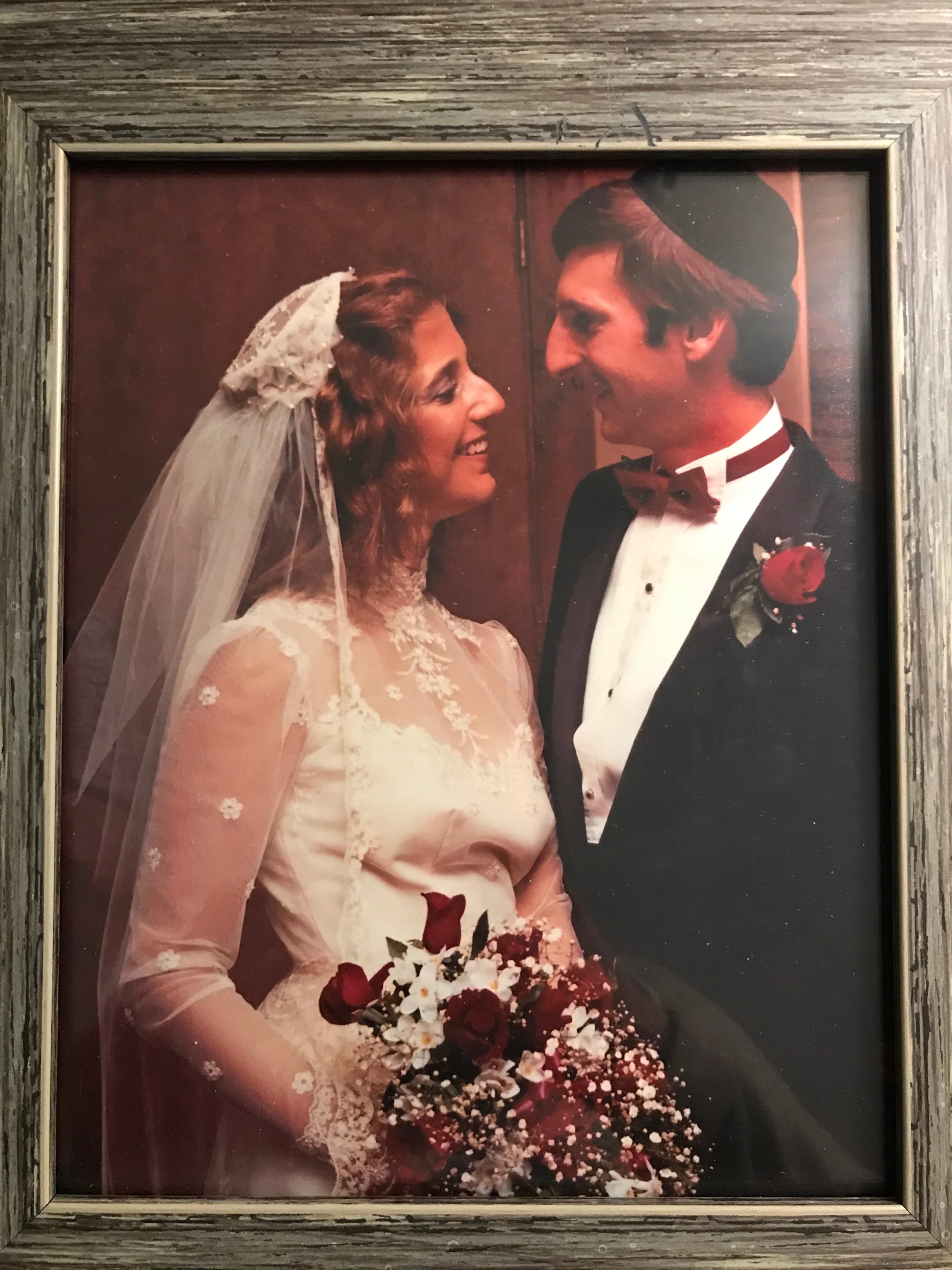 Isn't she lovely? My mom on her wedding day, August 7th, 1982. Of interest, my aunt also wore the same dress in April of 1984 at her wedding. It's quite an heirloom at this point!