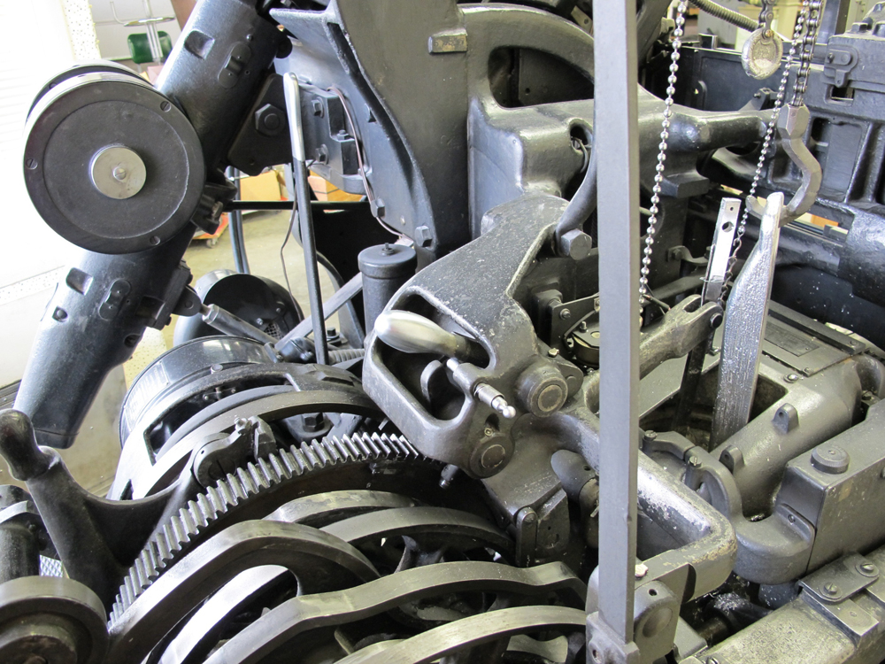 Back end of machine with view of plunger and pot. Also, notice quick drop is released