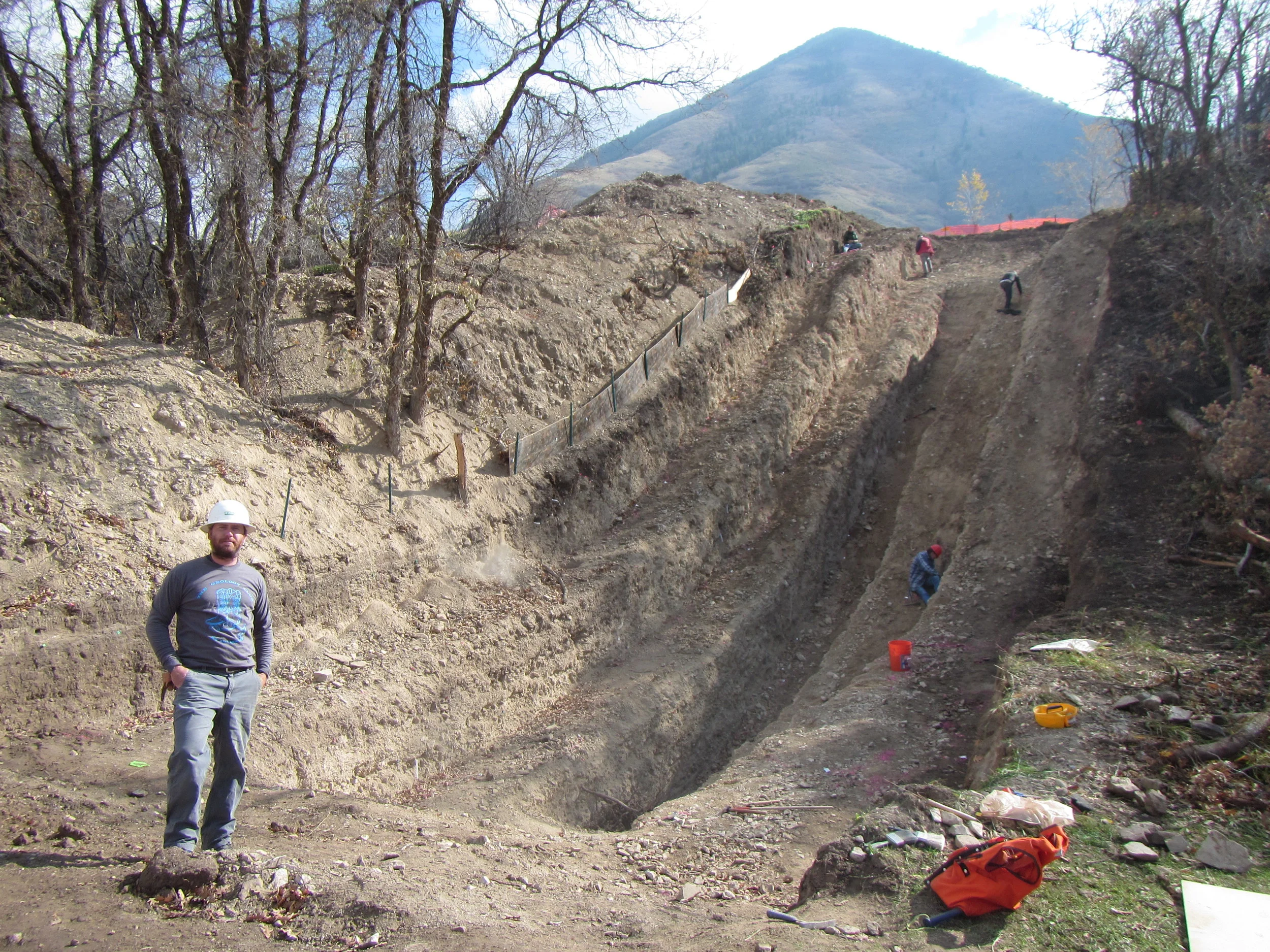 Bennett in UC Davis Geol Club shirt at Flat Canyon trench Wasatch fault.JPG