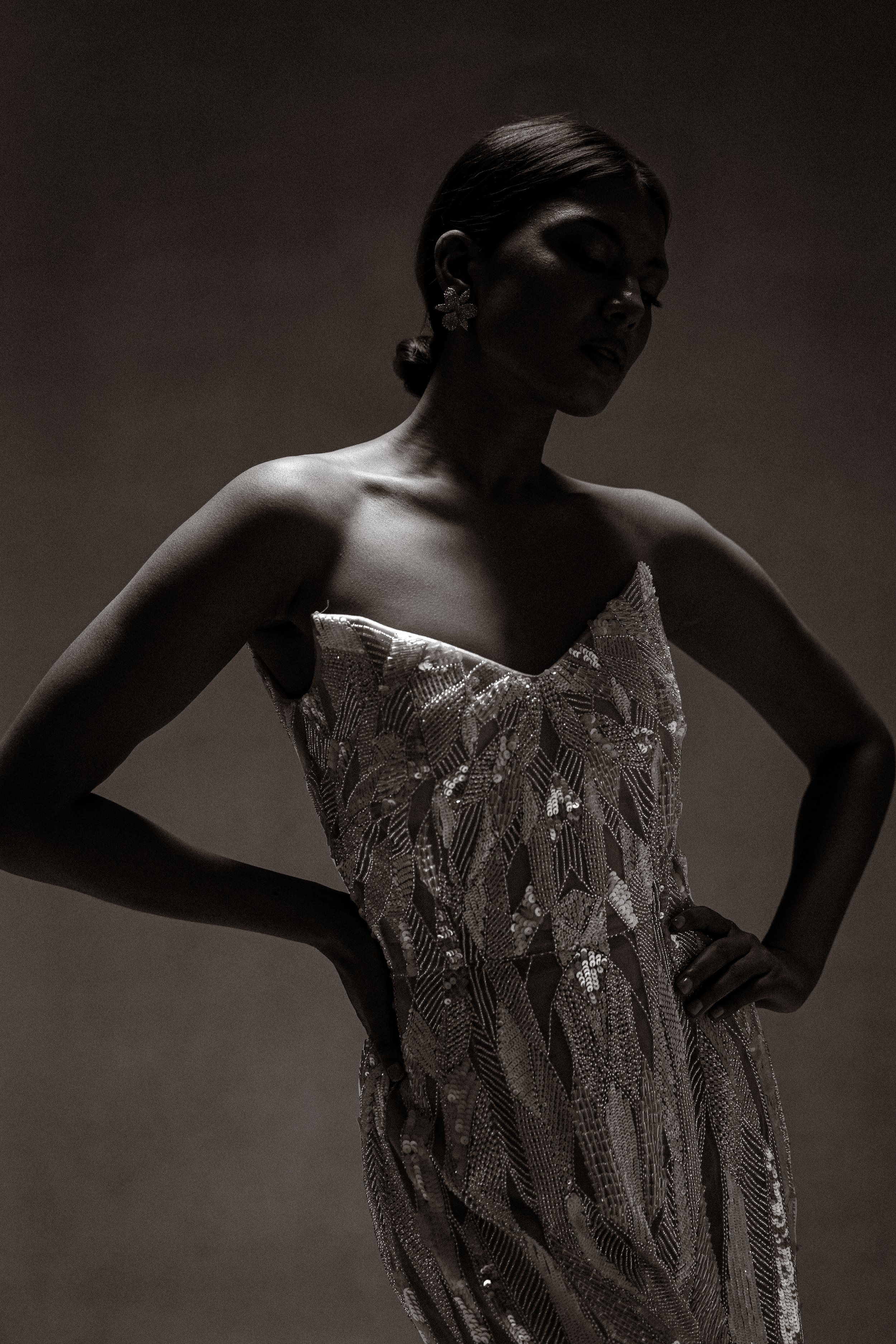 Campaign imagery mood shot Satori strapless gown silver and ivory