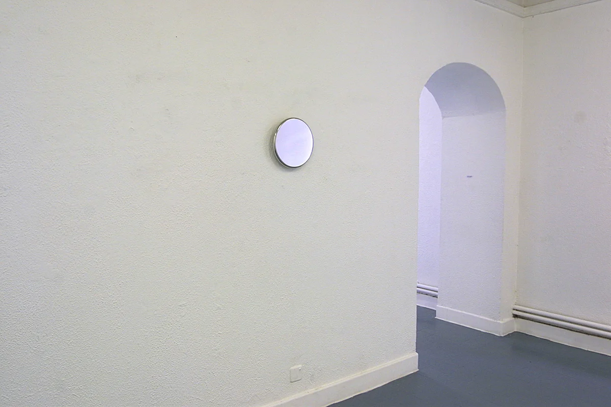 Double – two wall-mounted stainless steel disks on opposite walls facing each other&nbsp;Double &nbsp;- large disk &nbsp;2003 &nbsp;stainless steel &nbsp;29 x 2 cminstallation view&nbsp;Butler Gallery, Kilkenny, Ireland, 2003 