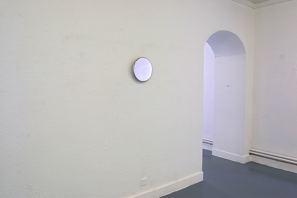 Double – two wall-mounted stainless steel disks on opposite walls facing each other Double - large disk 2003 stainless steel 29 x 2 cm installation view Butler Gallery, Kilkenny, Ireland, 2003