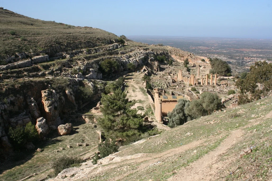 The Sanctuary and Temple of Apollo at Cyrene. Parts of the temple go back to the 6th century BC, but the colonnade re-erected by the Italians post-dates the Jewish Revolt in the 2nd century AD. (The revolt started at Cyrene in AD 115 and resulted in the destruction of most of the public buildings there.)