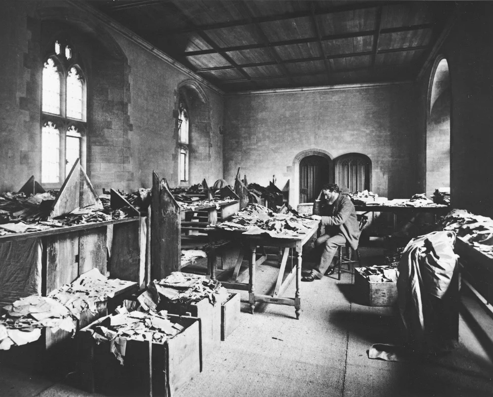 Solomon Schechter at work, in Cambridge, on the Cairo Genizah fragments | Cambridge, 1898 | Ori ginal photograph image