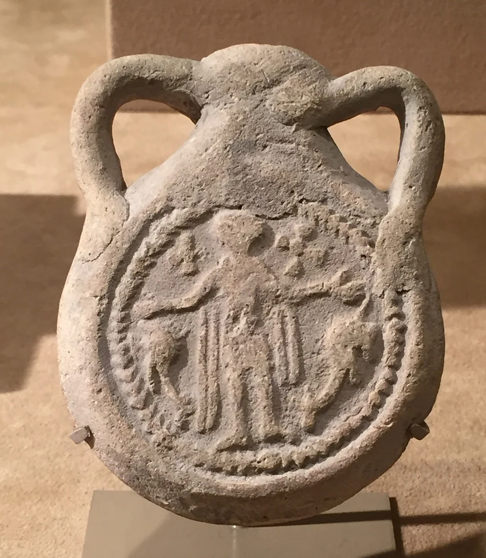 Ceramic Menas ampulla, for holding holy oil | Dated 610-50CE | Currently on display at the Met, New York Item No. 17.194.2291 .