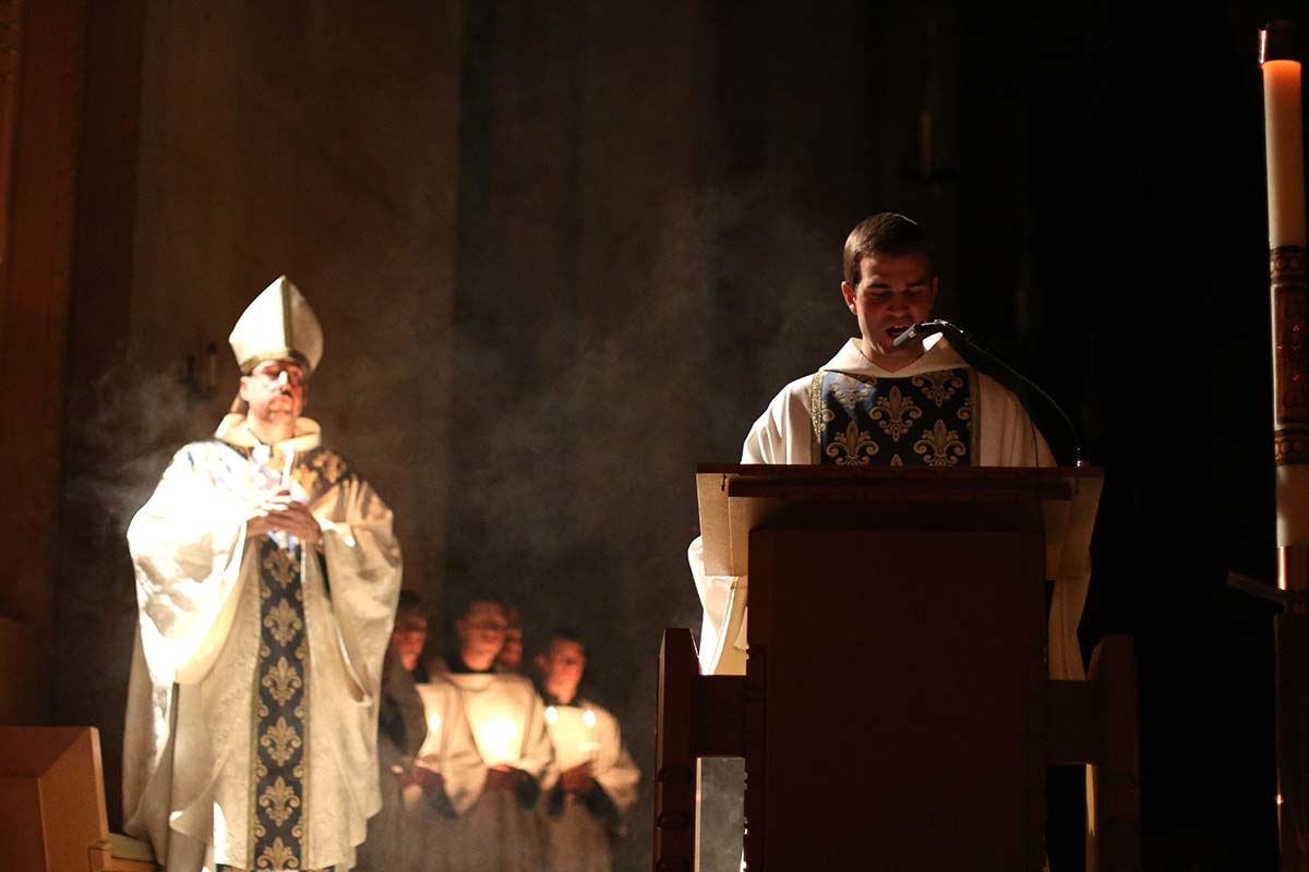 Br. Simon sings the Exultet at the Easter Vigil at St. Benedict's Abbey.