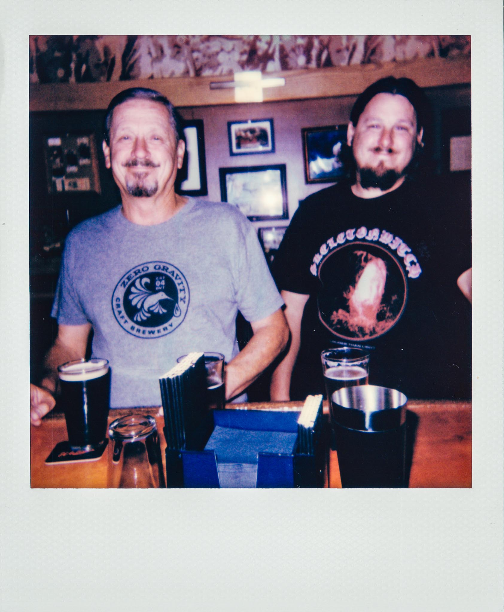 Father and Son Drinking at Wallys Mills Avenue Liquors Bar. 