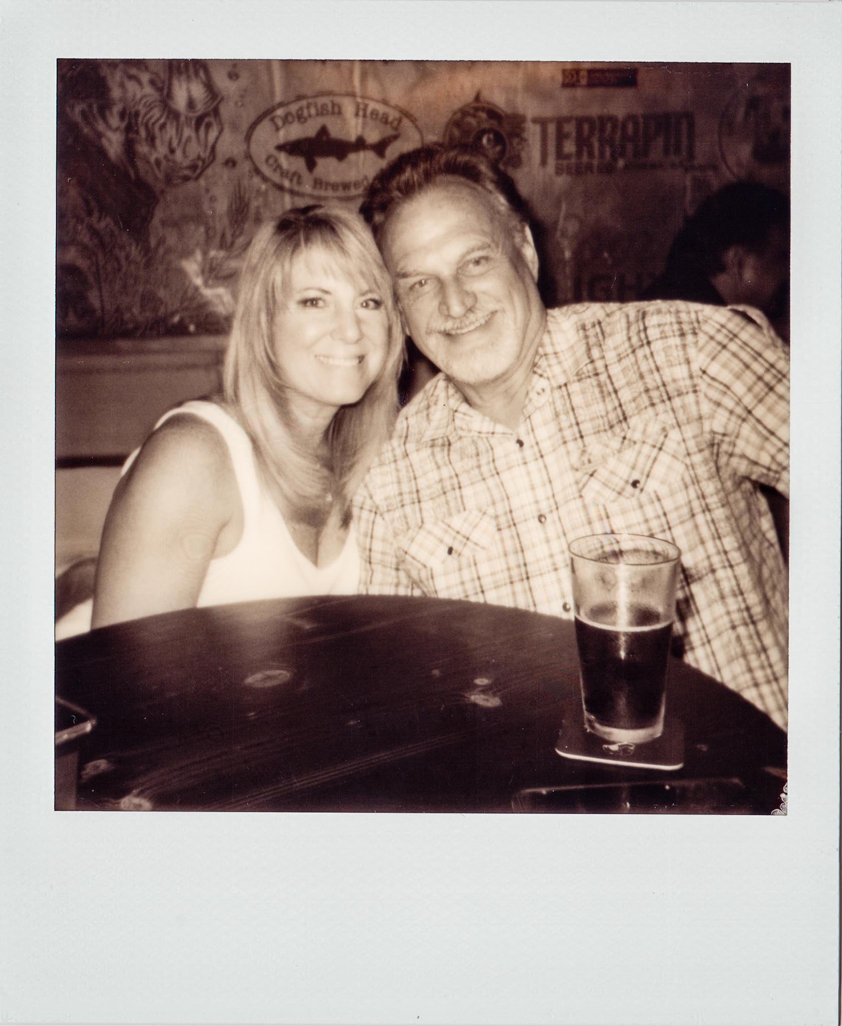 Couple enjoying a drink at Wallys Mills Avenue Liquors