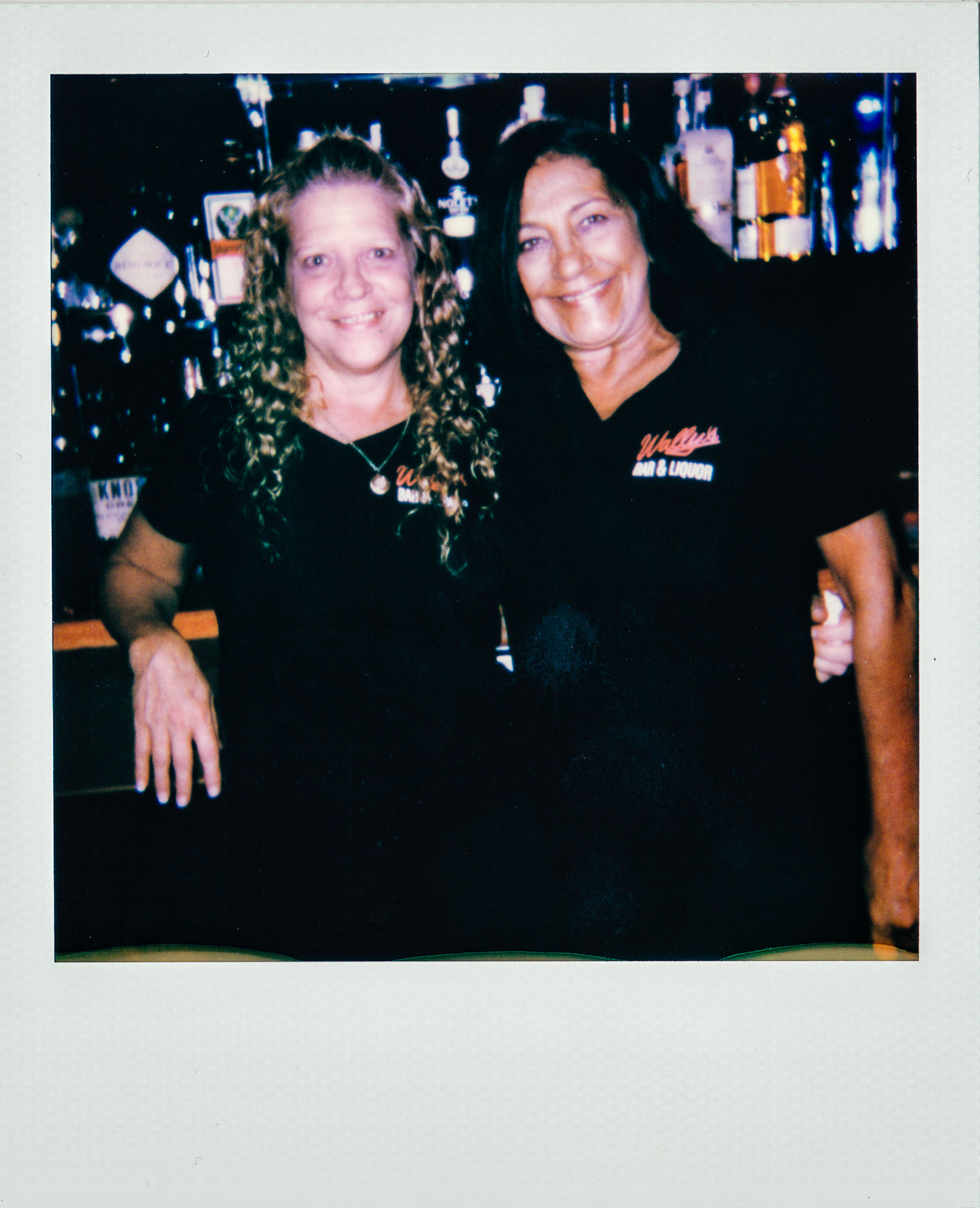 Two female bartenders at Wallys Mills Avenue Liquors