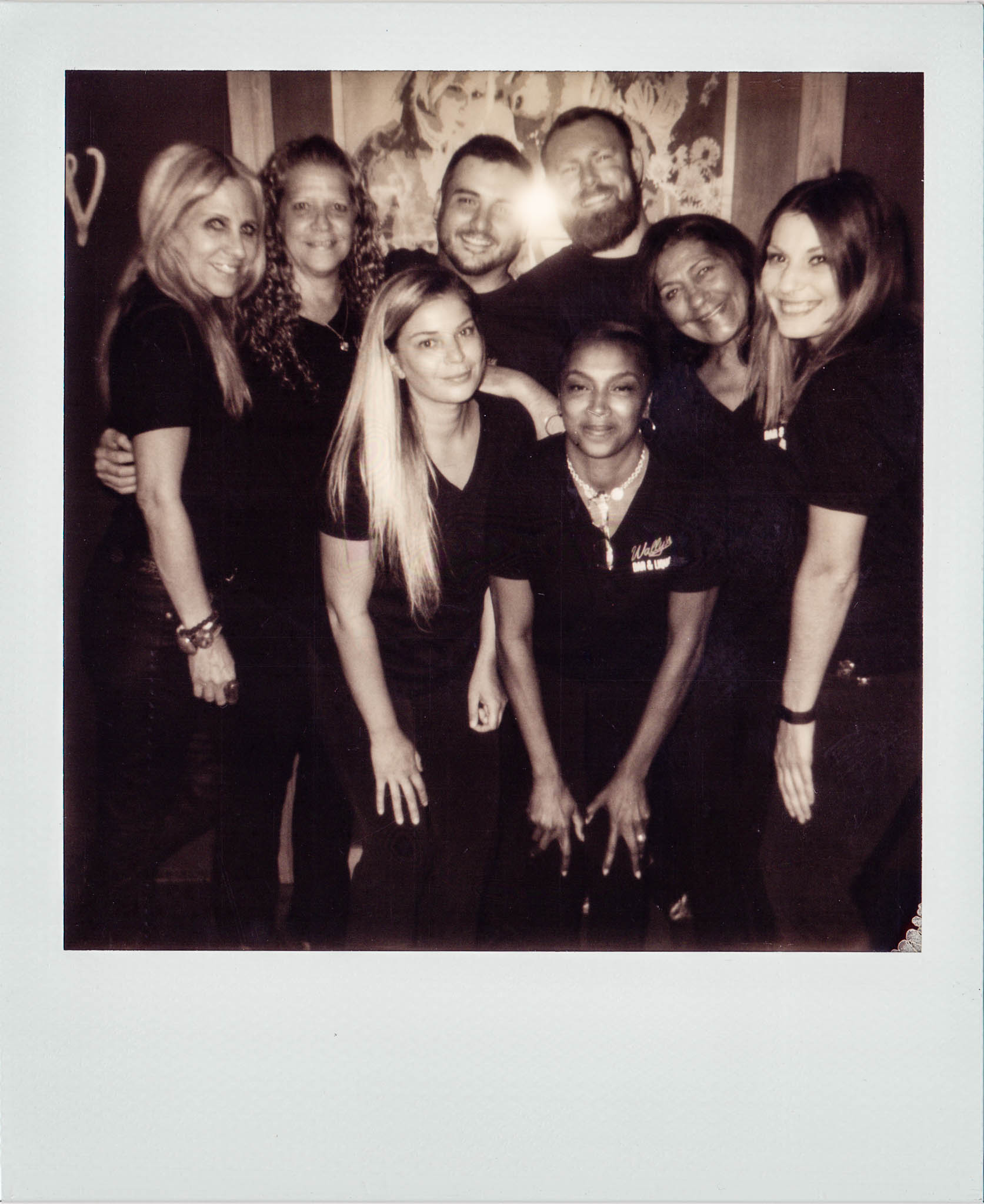 All of the bartenders posing together at Wallys Mills Avenue Liquors