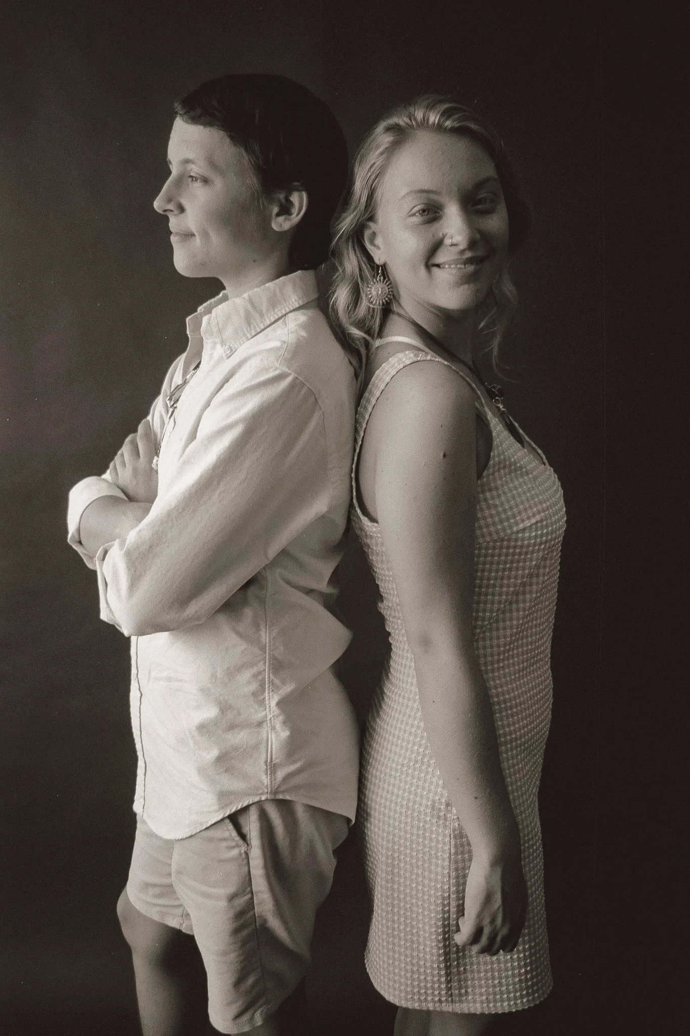 Guy and Girl standing back to back