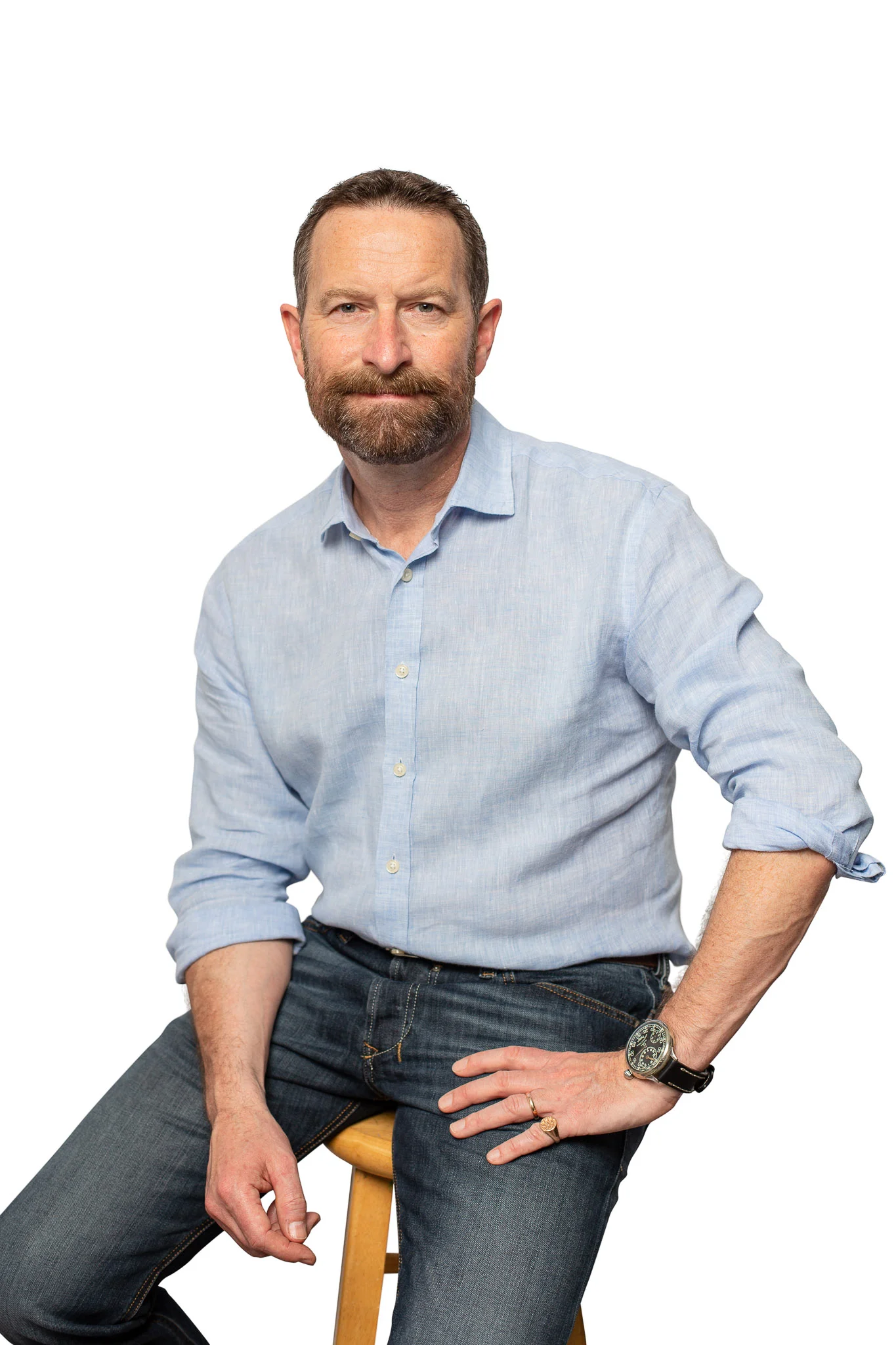  Duncan Wardle sitting in front of a white backdrop 