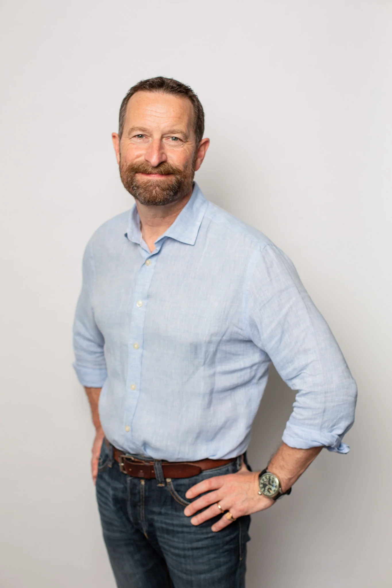  Duncan Wardle on a white backdrop in a blue shirt 