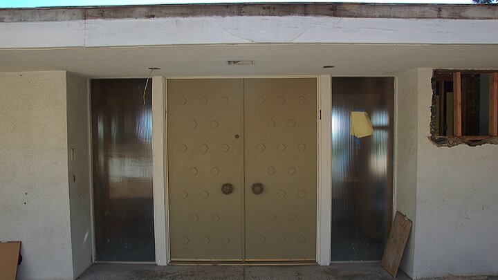 slide1_before_Berchtold_Harris_Before_Renovation_Door_Entrance.jpg