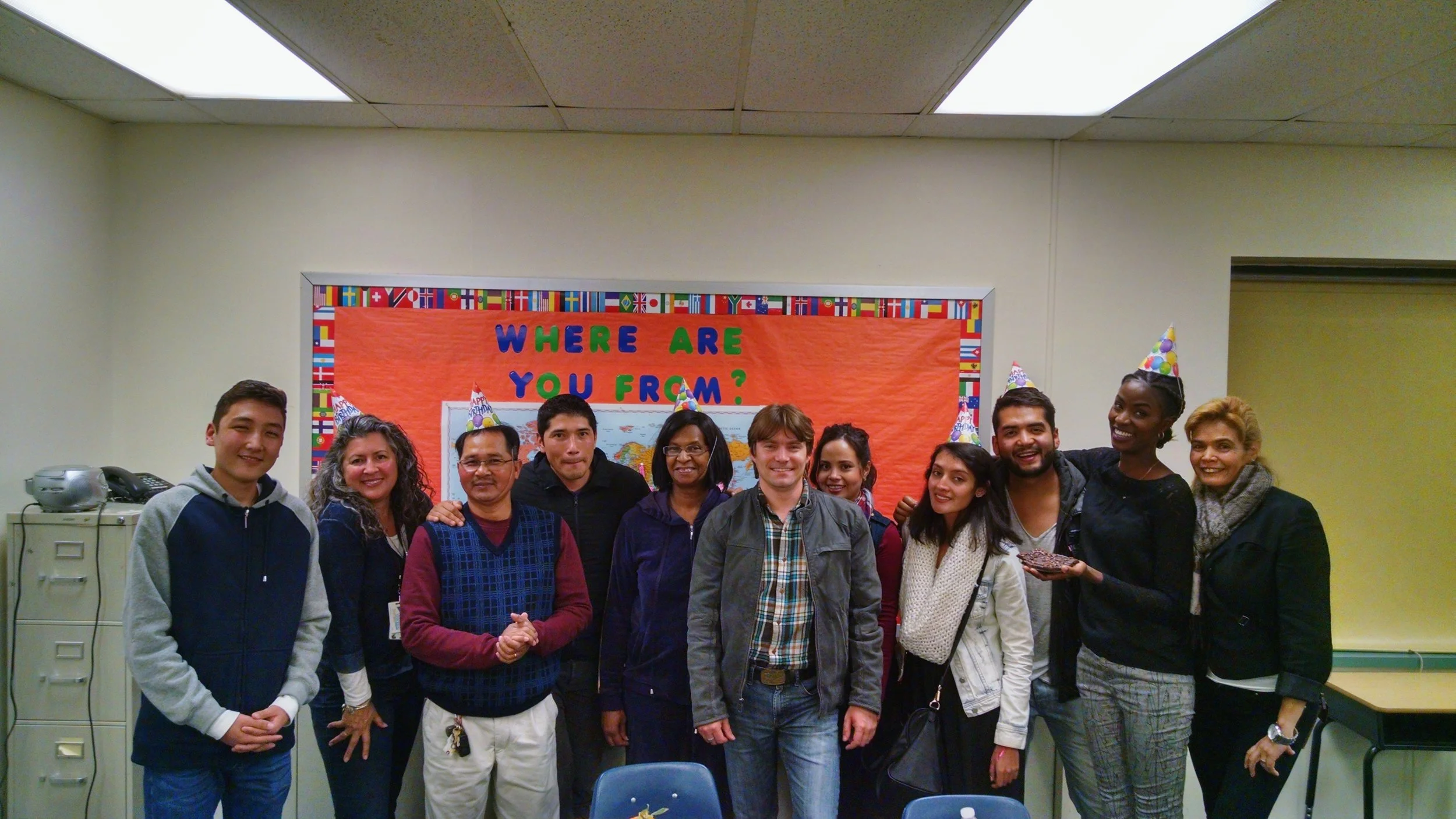 Celebrating a Newport News Adult Education ESL class celebrating a student's birthday.