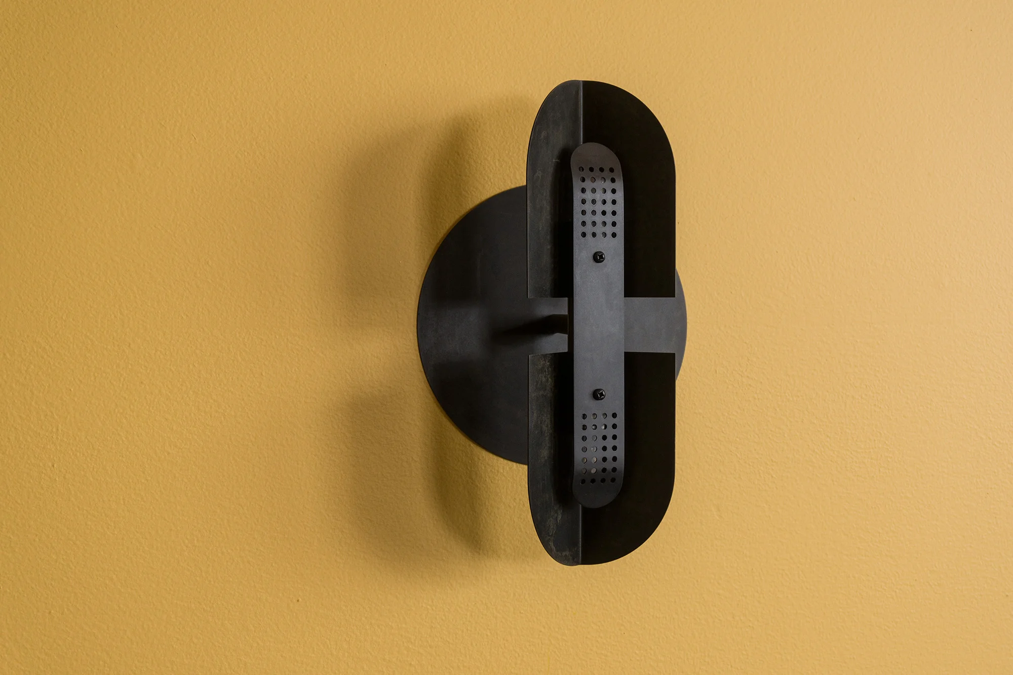 Fold Sconce options shown here: Black patina finish. Perforated cover. Large backplate.