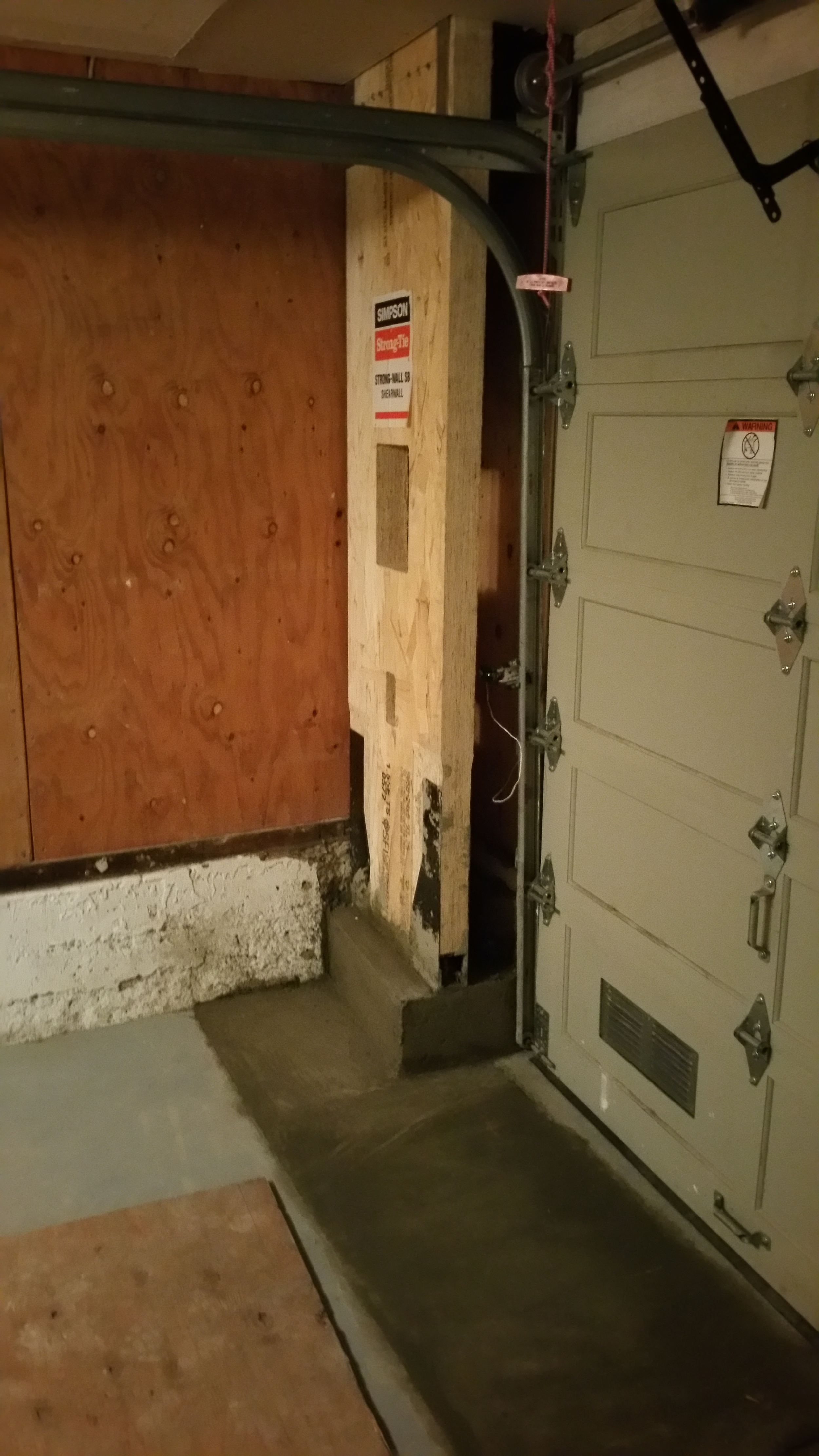 Simpson Strong wall embeded in new concrete grade beam