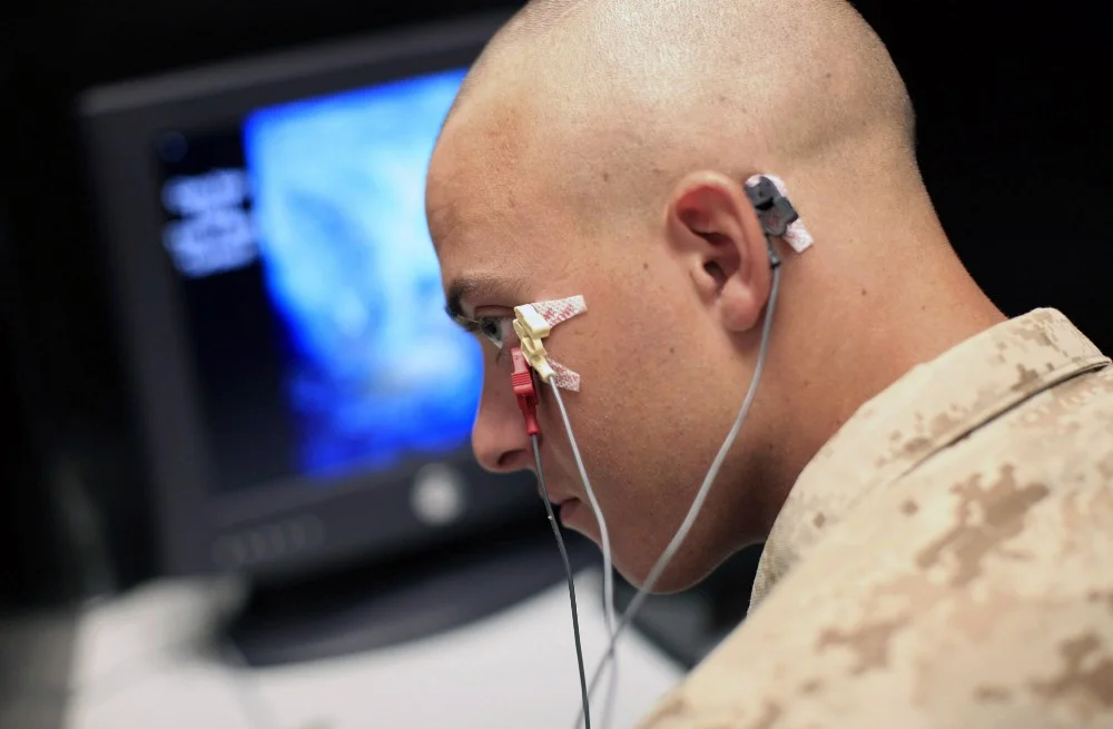 U.S. marines undergo testing for PTSD symptoms and predisposition—including eye blink monitoring—but treatments remain mostly ineffective. (AP Photo/Jae C. Hong)