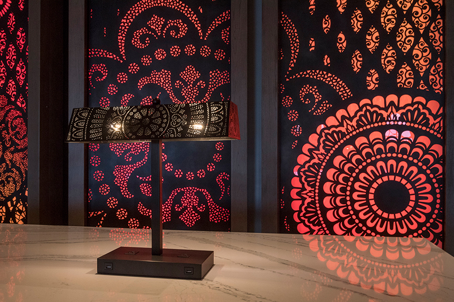 The Barcelona Lounge, located on the lower lobby level, features eclectic patterns and colors inspired by the unique aesthetic of Barcelona, Spain. Seating areas include large murals, including art with Walt Disney and Mickey Mouse.