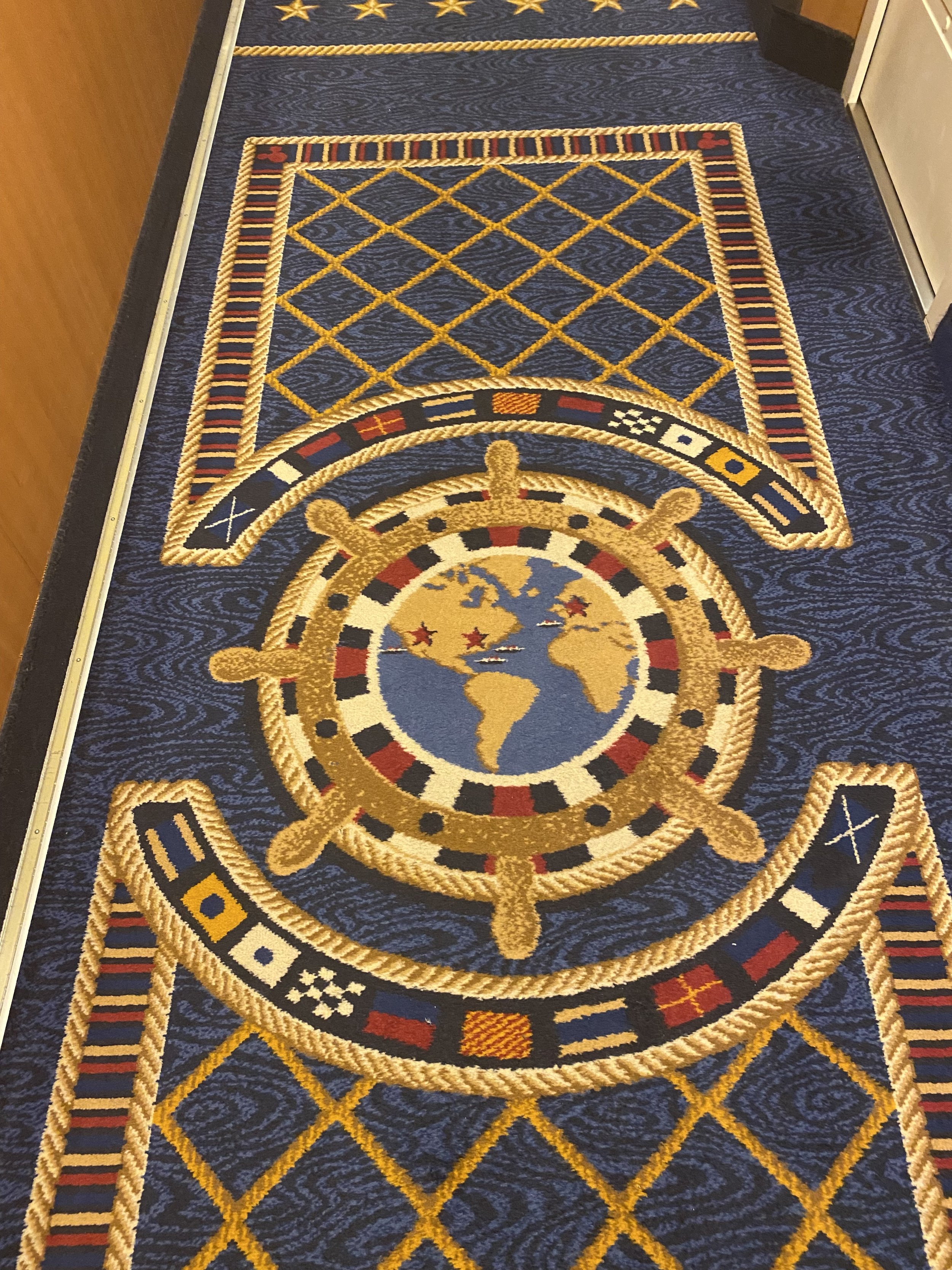  Fun fact:  the carpet in the hallways help tell guests and crew where they are, and where they are going. For example, if the map is facing you,  you’re walking toward the front of the ship (forward). If the map is upside down, you’re walking towar