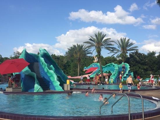  The pool at Port Orlean’s French Quarter has a whimsical theme, a pool bar, a whirlpool, and a water slide.  
