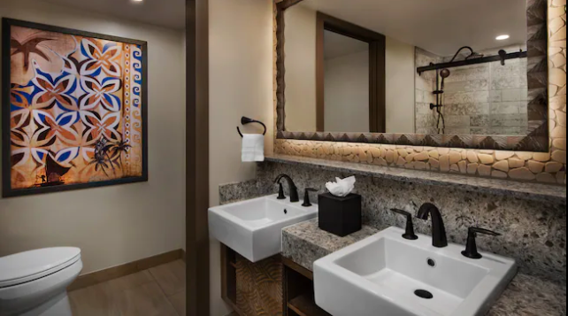  Spacious bathrooms have a double vanity with a separate water closet. There’s a tub/shower combo with luxury fixtures.  