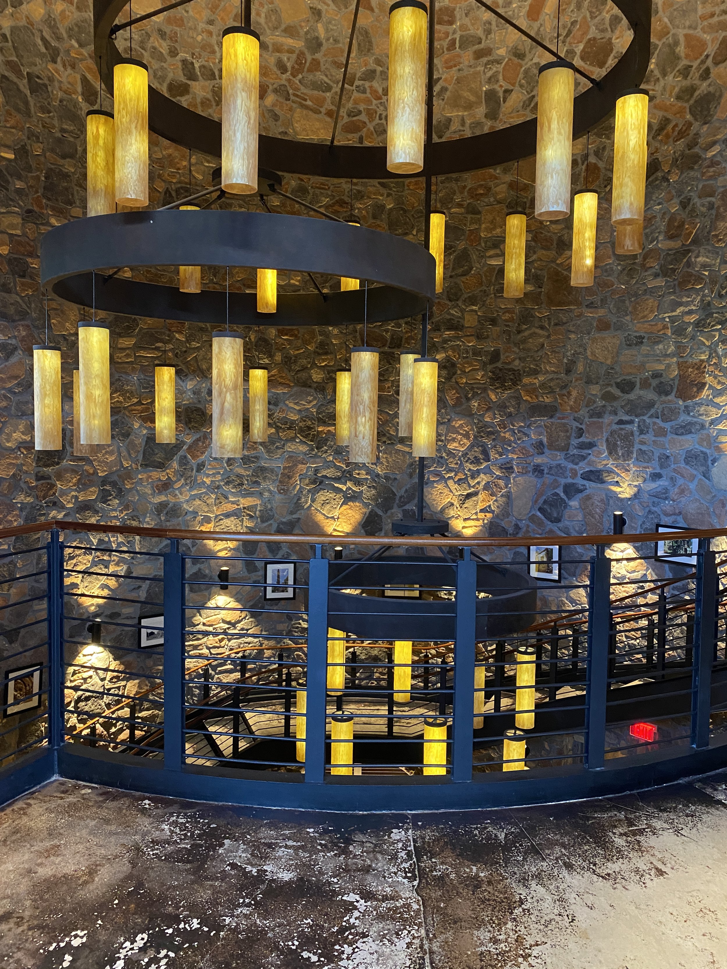  Just off the lobby you’ll find a massive spiral staircase leading to dining options and the pool.  