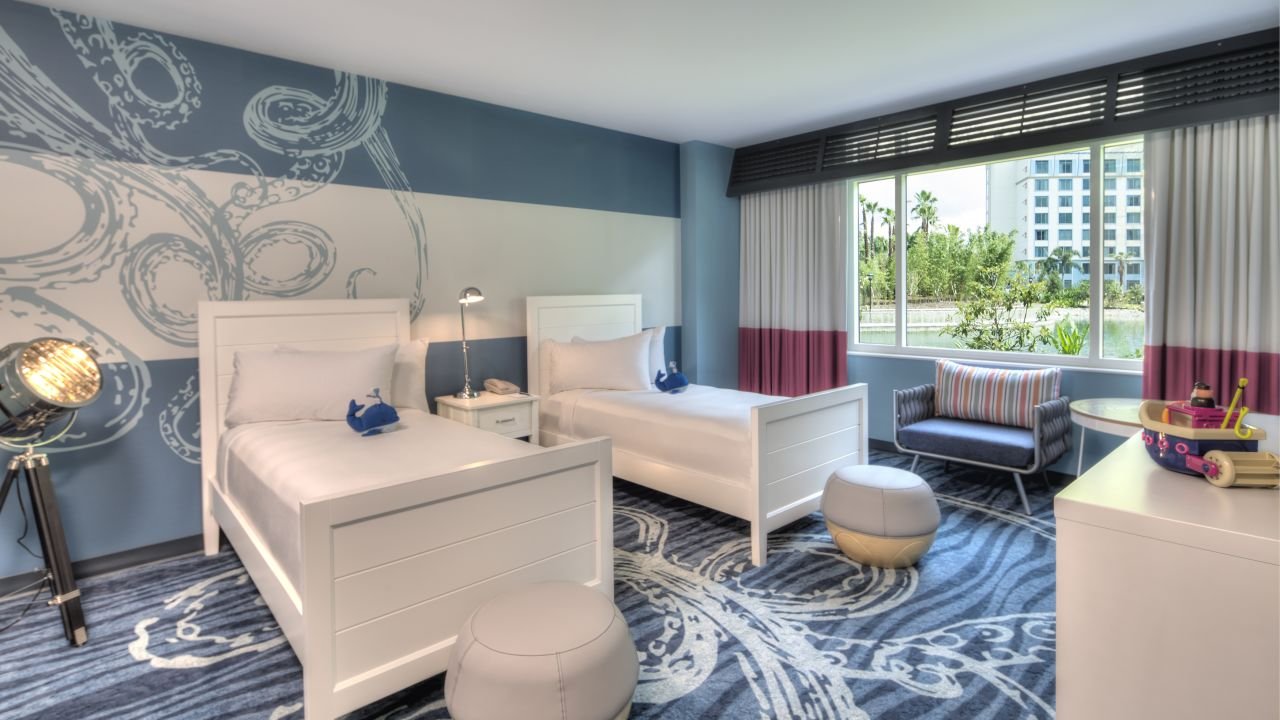  The kids suite features a king bed and two twin beds in a separate bedroom. The two separate rooms are connecting and feature a single entrance to the adult room.     The children's room opens only into the adult’s room, and not into the hallway.   