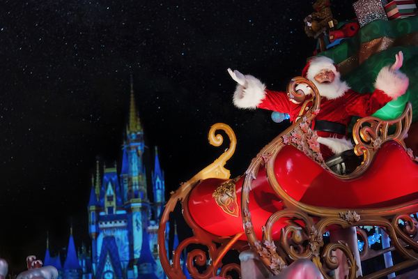 santa claus at magic kingdom park in front of castle