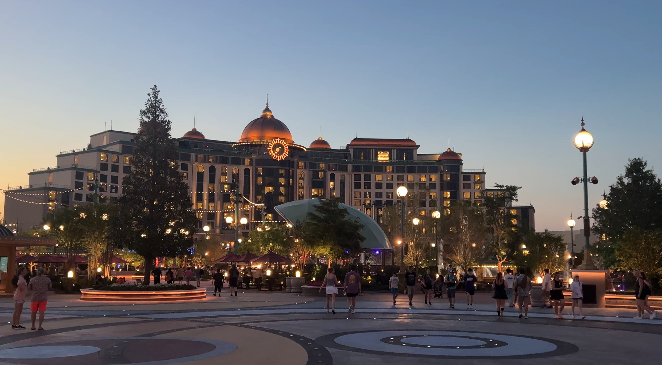 Helios Grand Hotel at Epic Universe lit up at nighttime