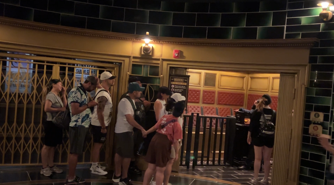 people waiting in line at wizarding world harry potter ride