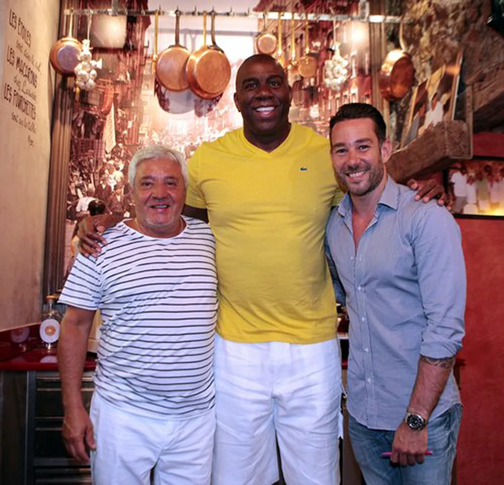 Herve Mamo (left) with one of the biggest fans of MAMO Le Michelangelo, the legendary basketball player Ervin Magic Johnson and Mike Mamo (right) 