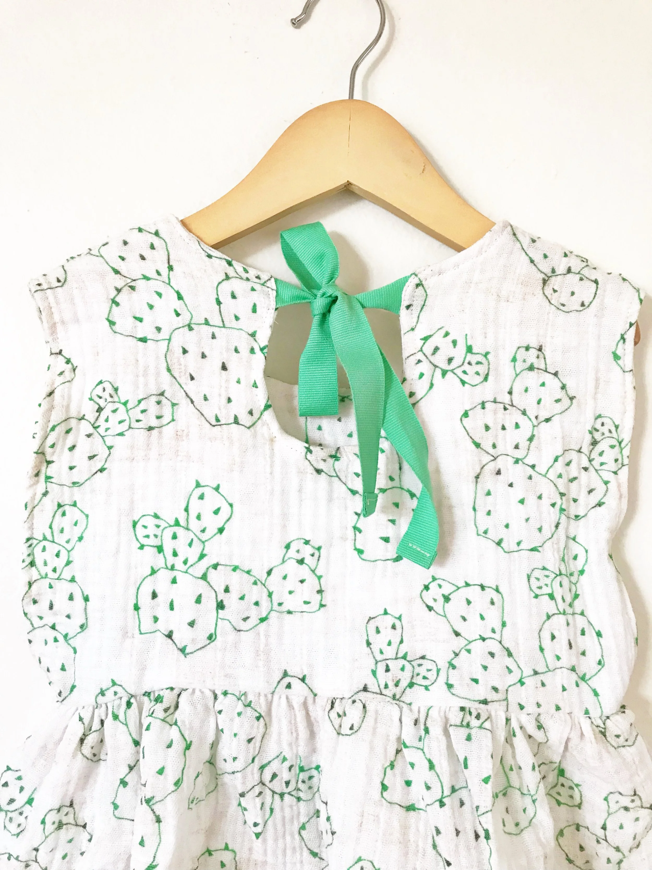 tie back peplum top in cactus print