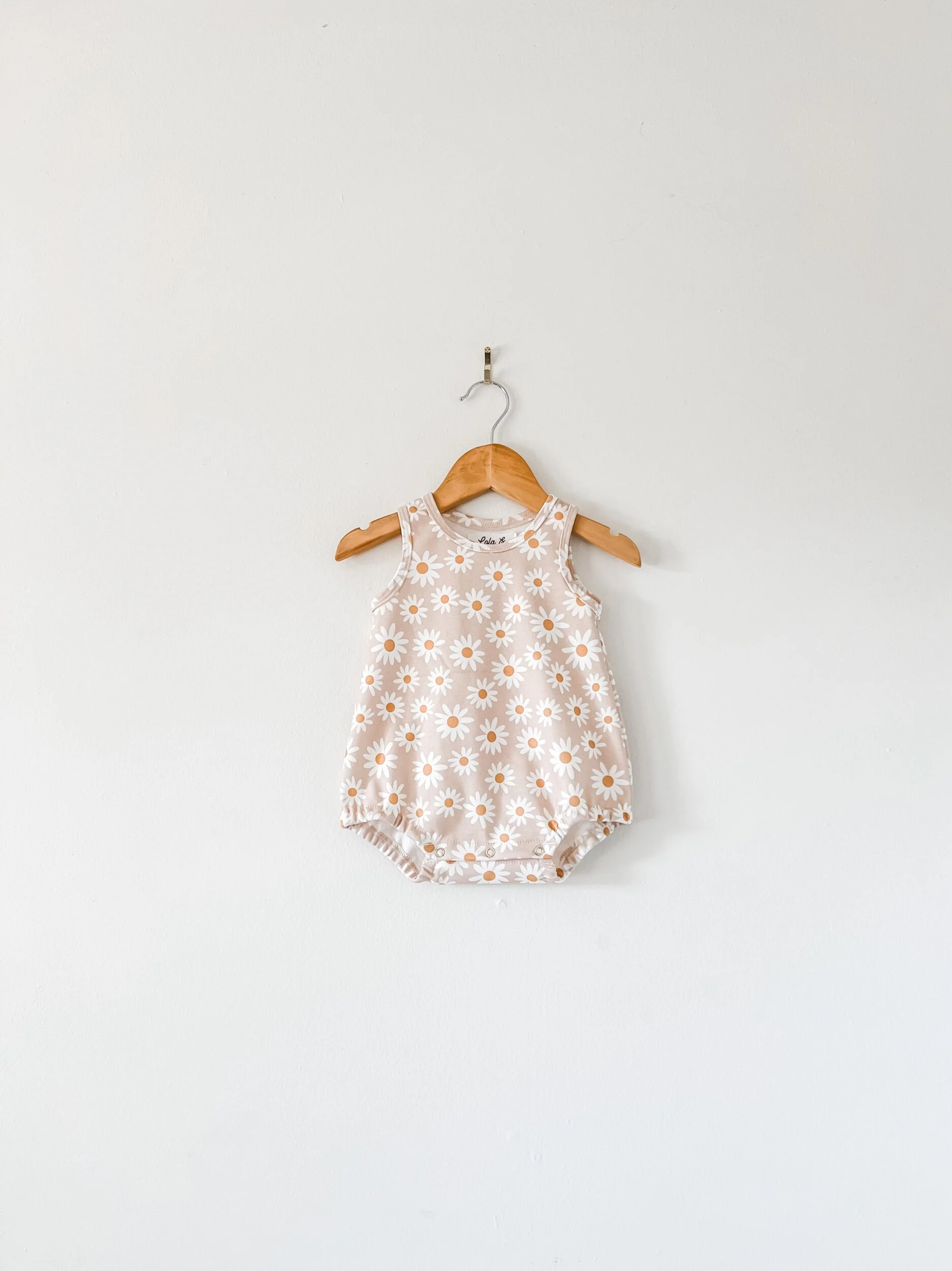 baby bubble romper in pinky beige daisy print