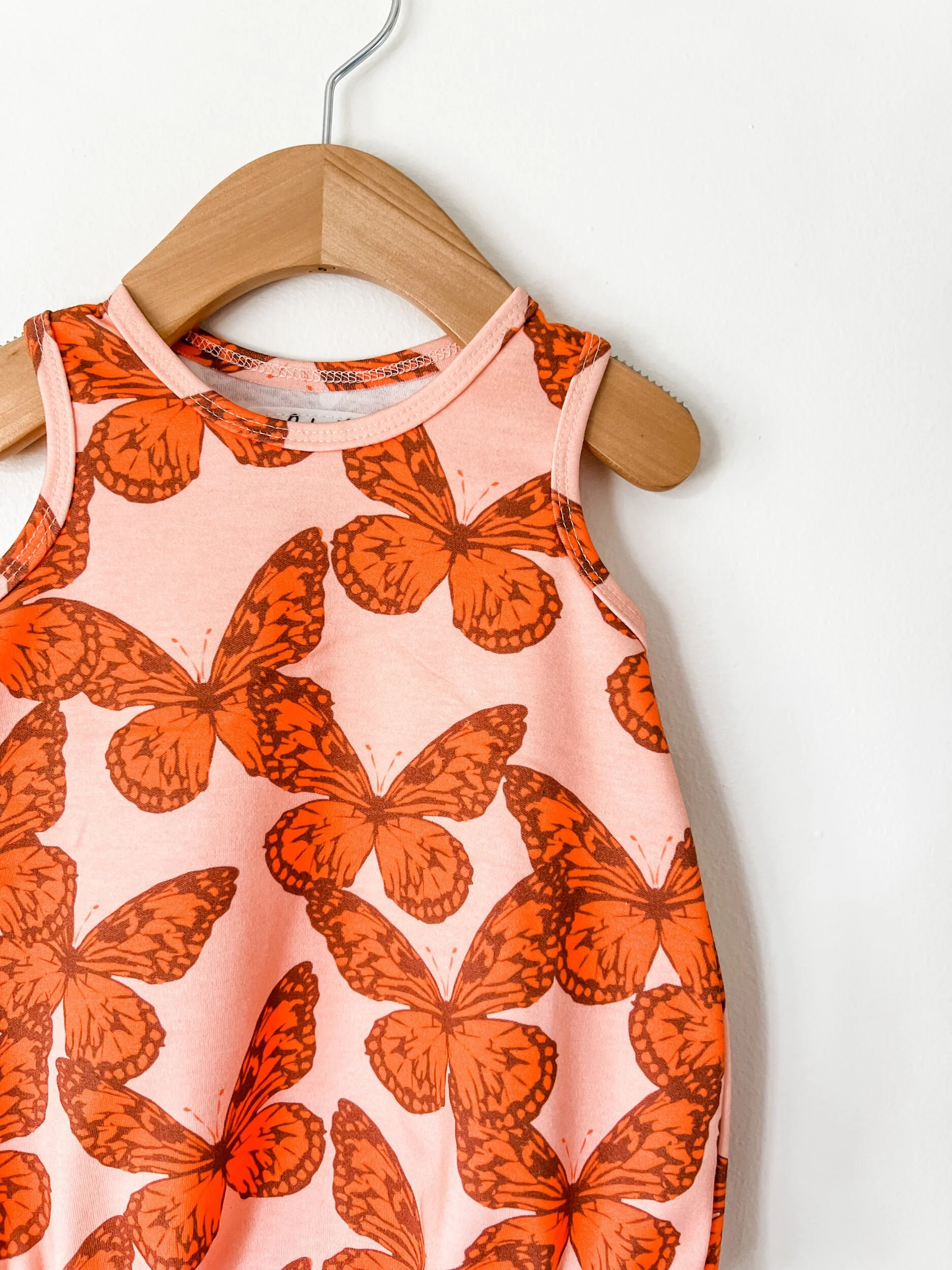baby bubble romper in pink with orange butterflies