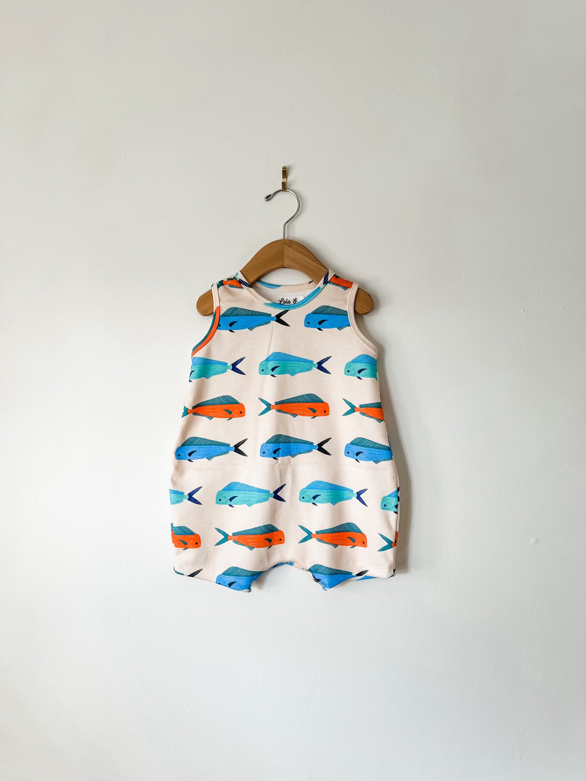 baby romper in off white with blue and red mahi mahi