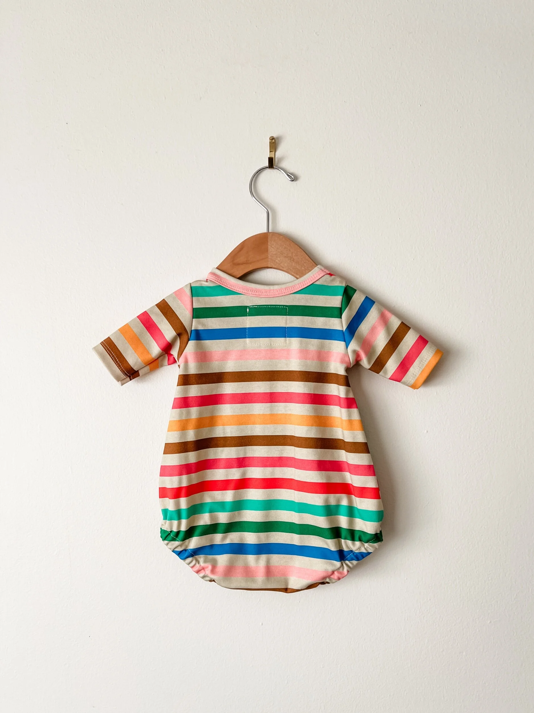 baby bubble romper in rainbow colored stripes