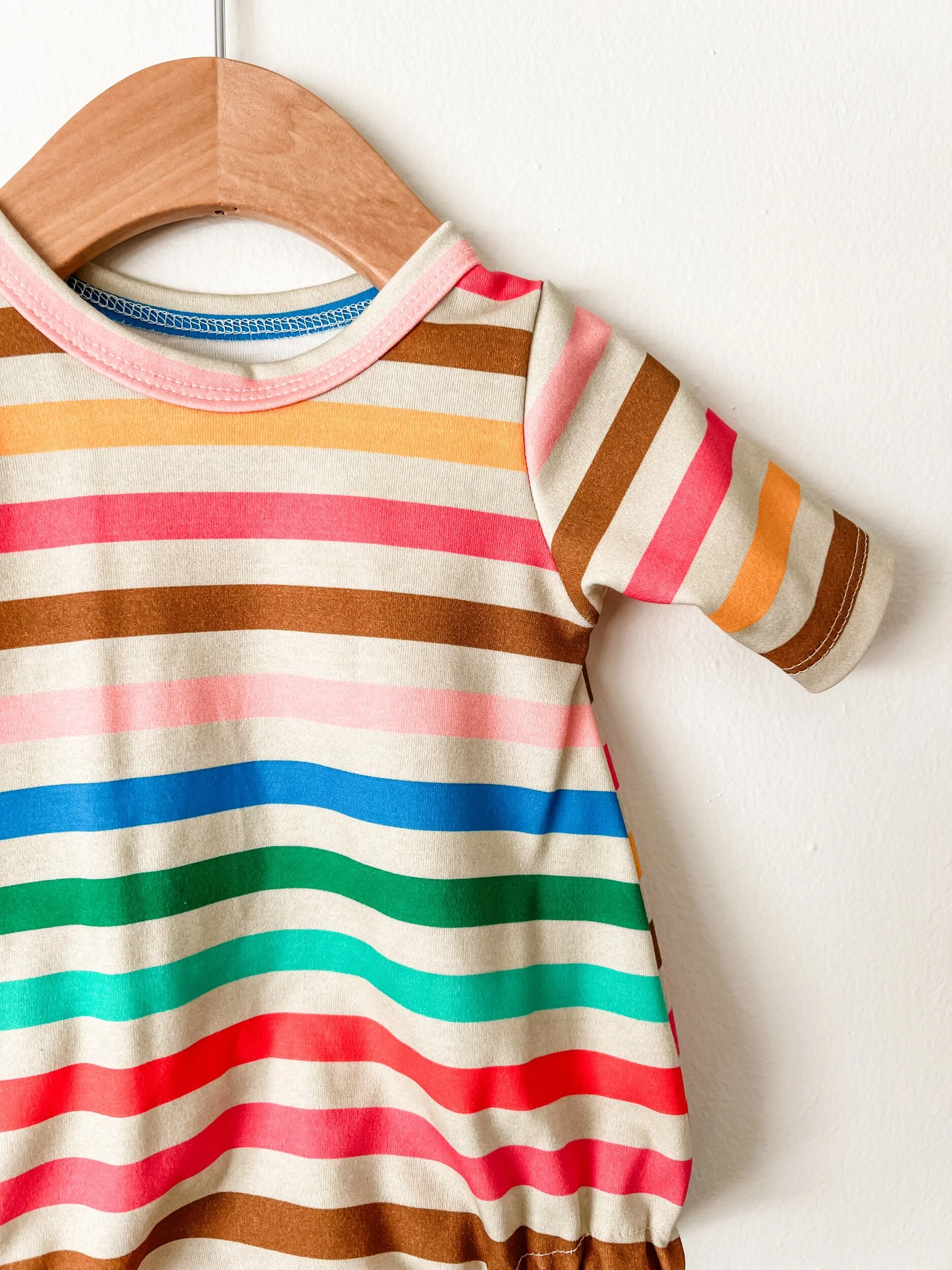 baby bubble romper in rainbow colored stripes