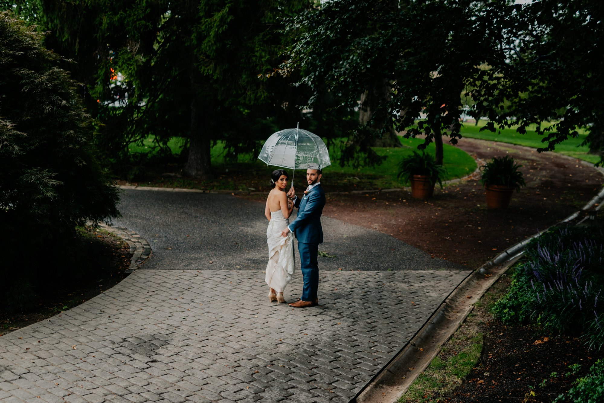 Lush Rainy Wedding at Knowlton Mansion in Philadelphia PA Moody Shadows and Umbrella Portraits