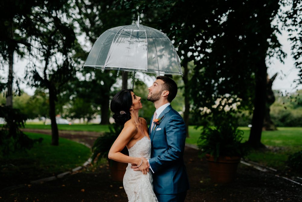 Lush Rainy Wedding at Knowlton Mansion in Philadelphia PA Moody Shadows and Umbrella Portraits